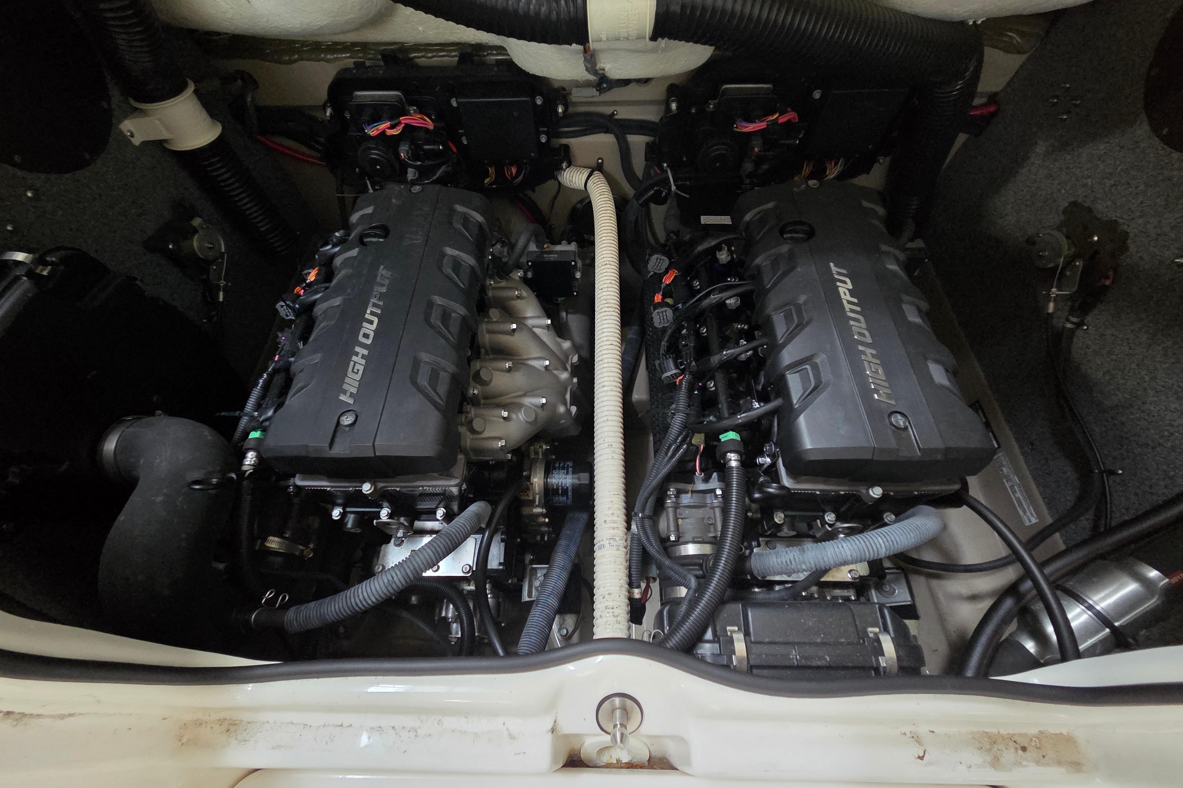 Engine compartment of a 2013 Yamaha 242 Limited S boat, featuring dual high-output engines.