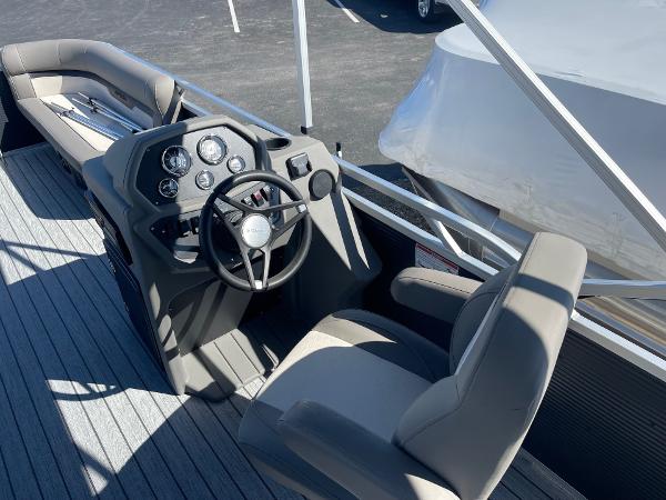 2025 Armada Saphir 23CR boat interior with steering wheel and seating.