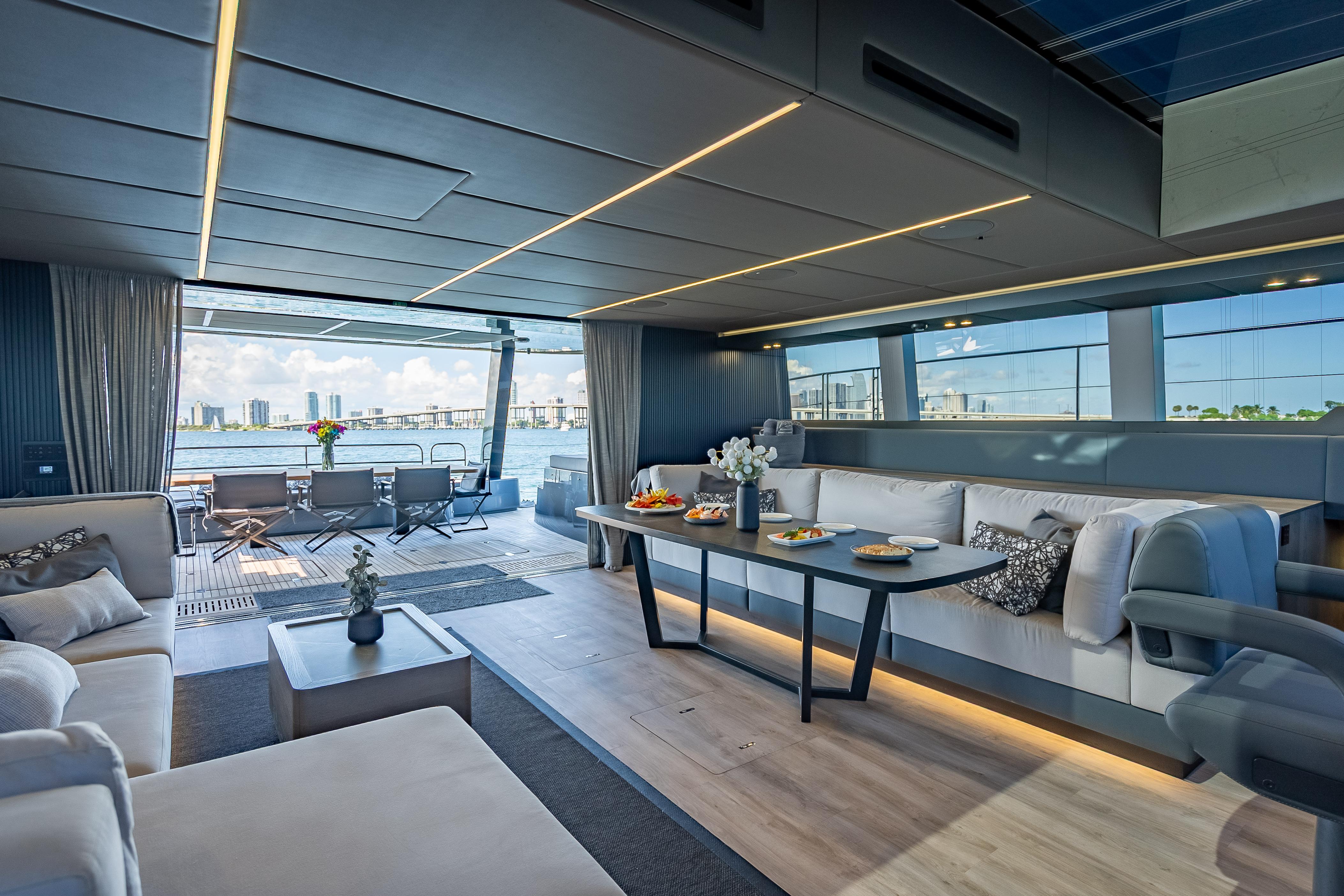Luxurious interior of 2026 Sunreef 60 Power yacht with elegant seating and ocean view.