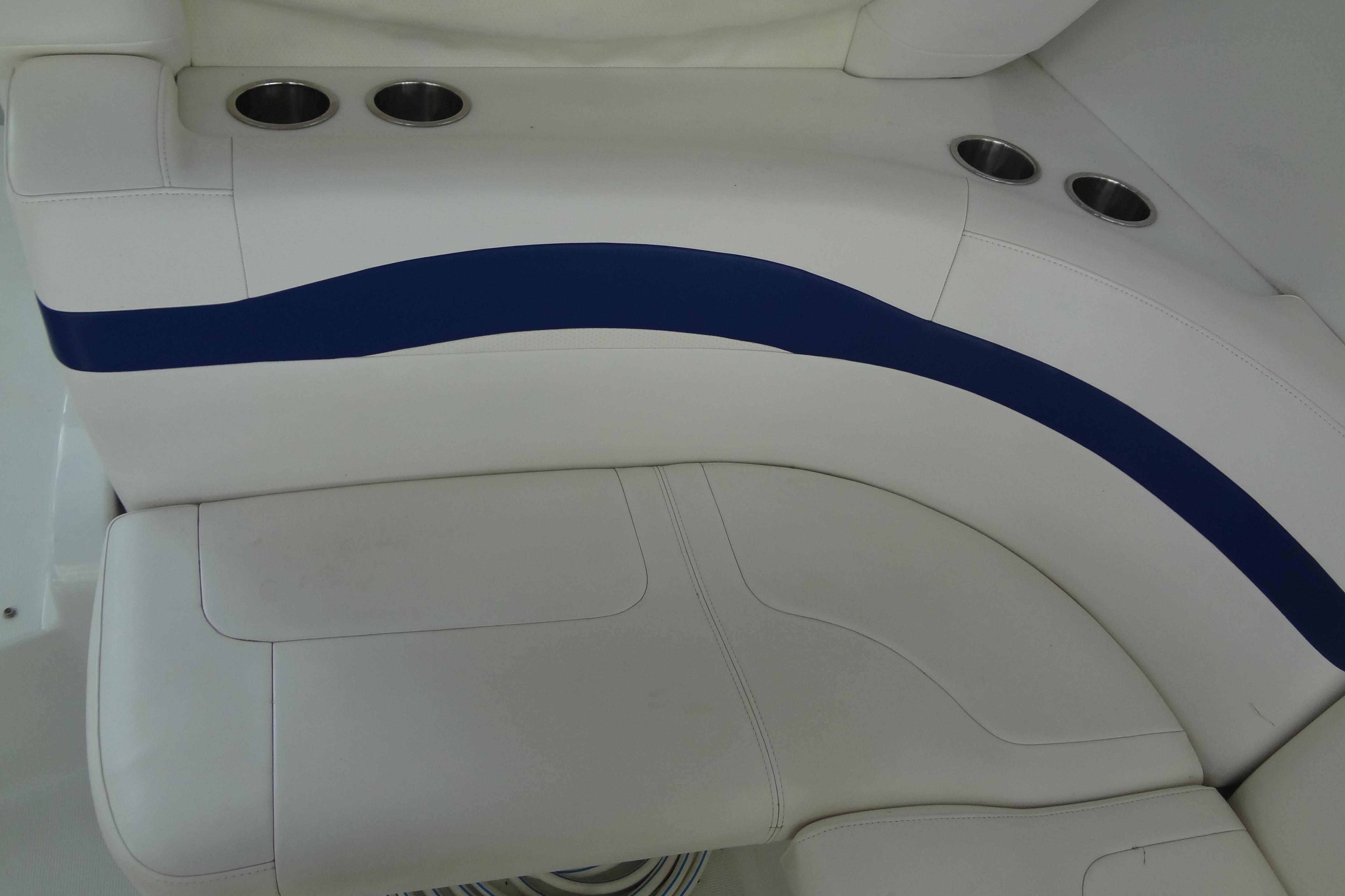 White and blue seating with cup holders on a 2007 Formula 34 Performance Cruiser.