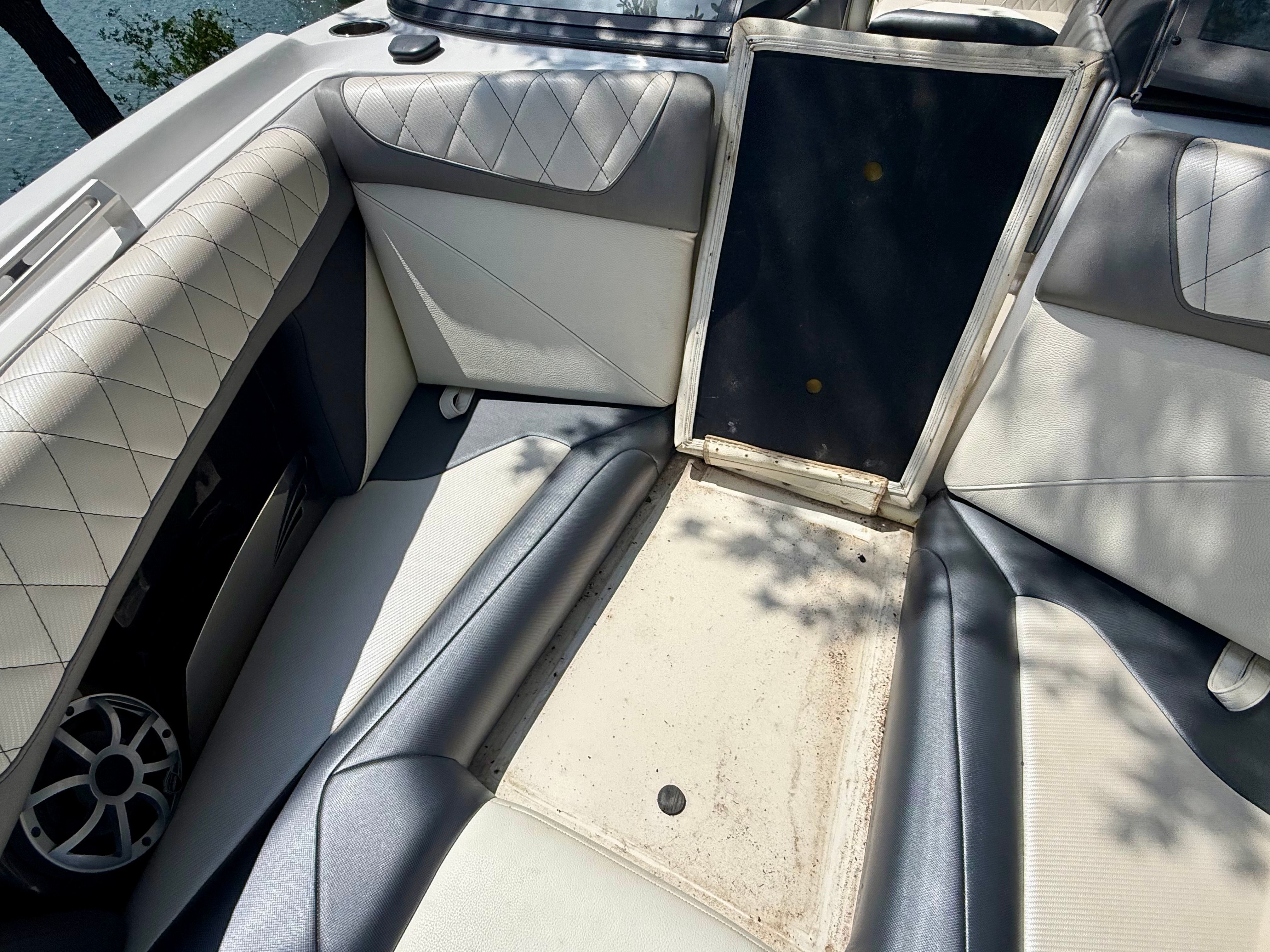 Interior of a 2017 Tigé Z3 with cushioned seating and speaker.