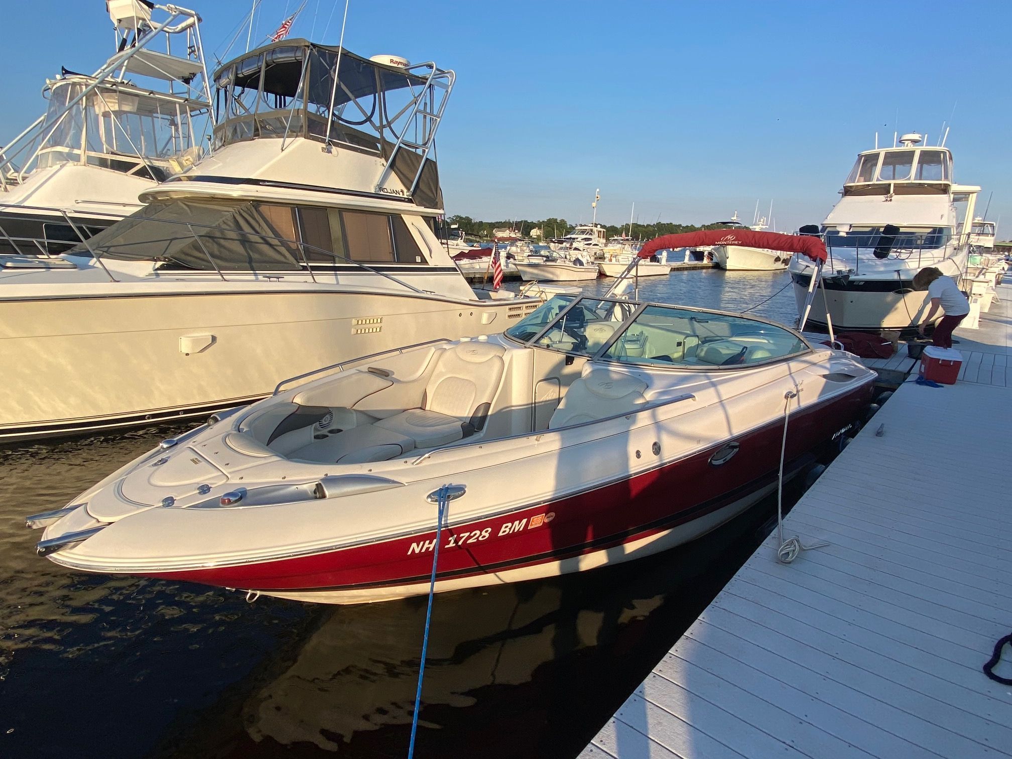 A 2006 Monterey 268SS Super Sport docked. It features a red and white design.