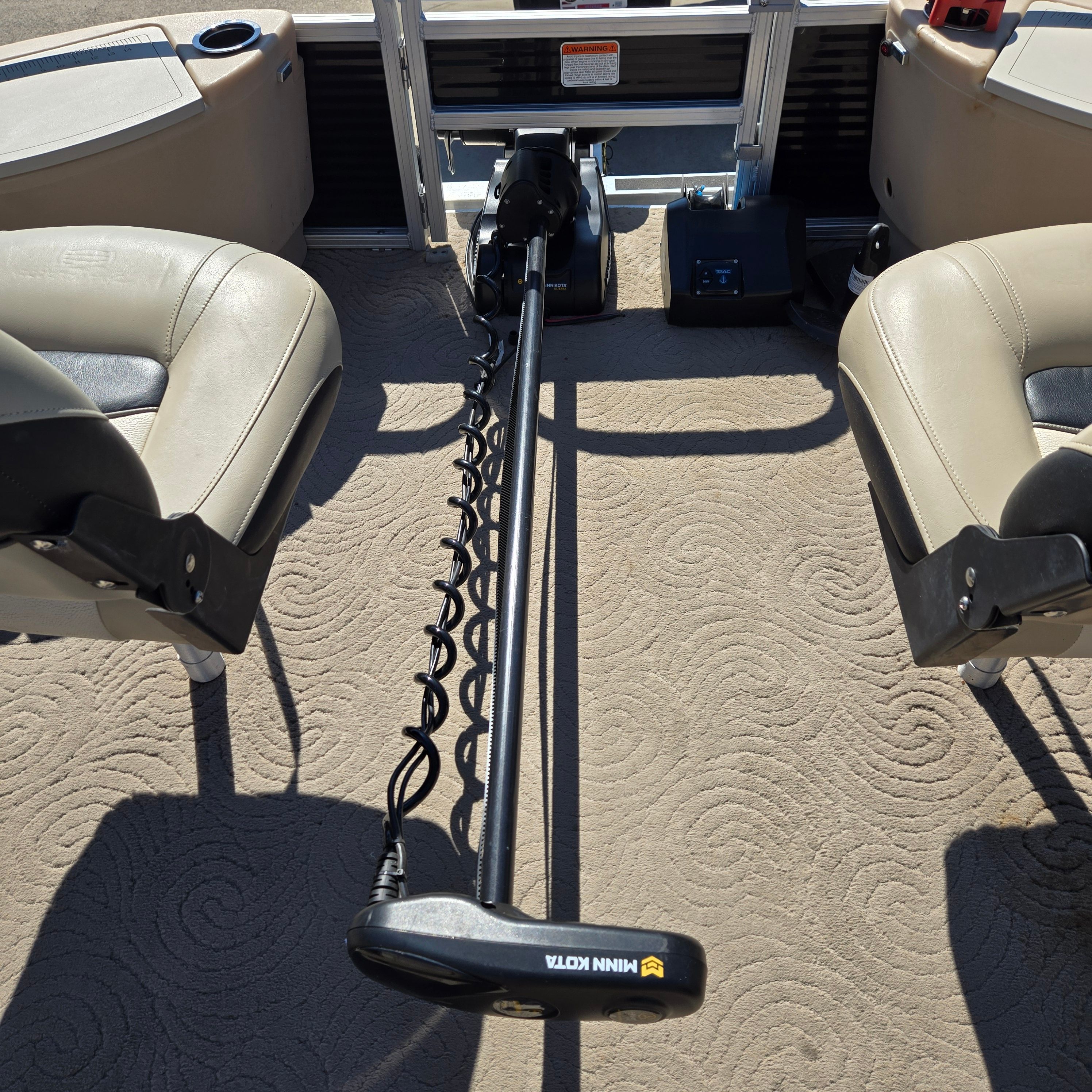 Interior view of a Sun Tracker Fishin' Barge 24 DLX with Minn Kota trolling motor.