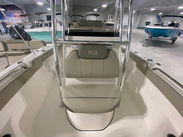 2024 Key West 203 FS boat interior, featuring beige seating and stainless steel frame.
