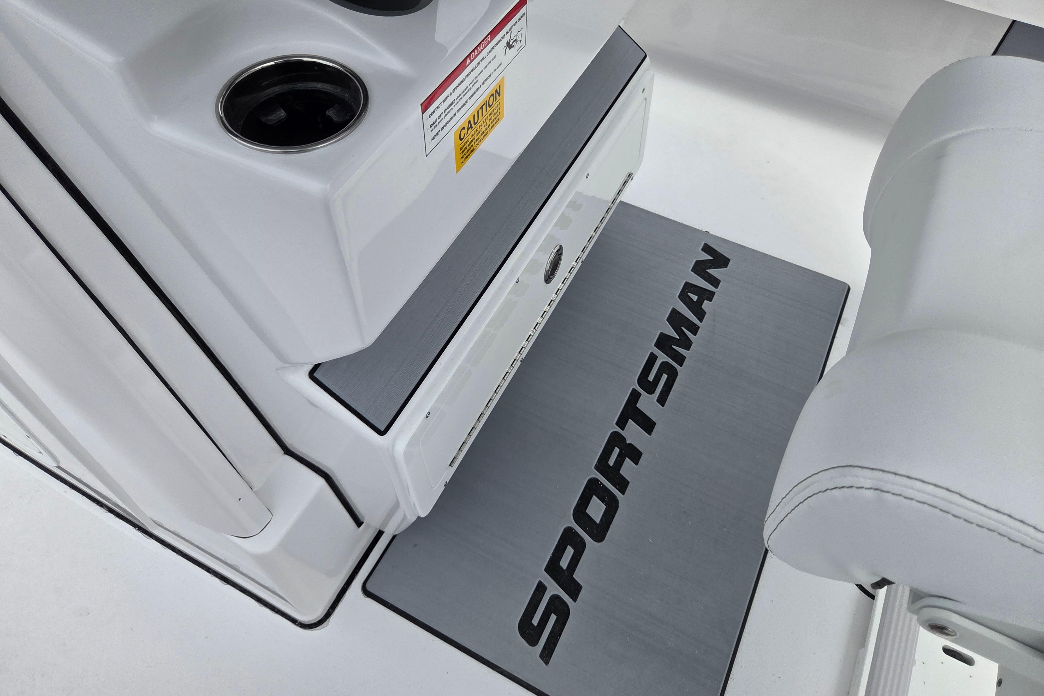2026 Sportsman Masters 247 Bay Boat interior with branded mat and cup holders.
