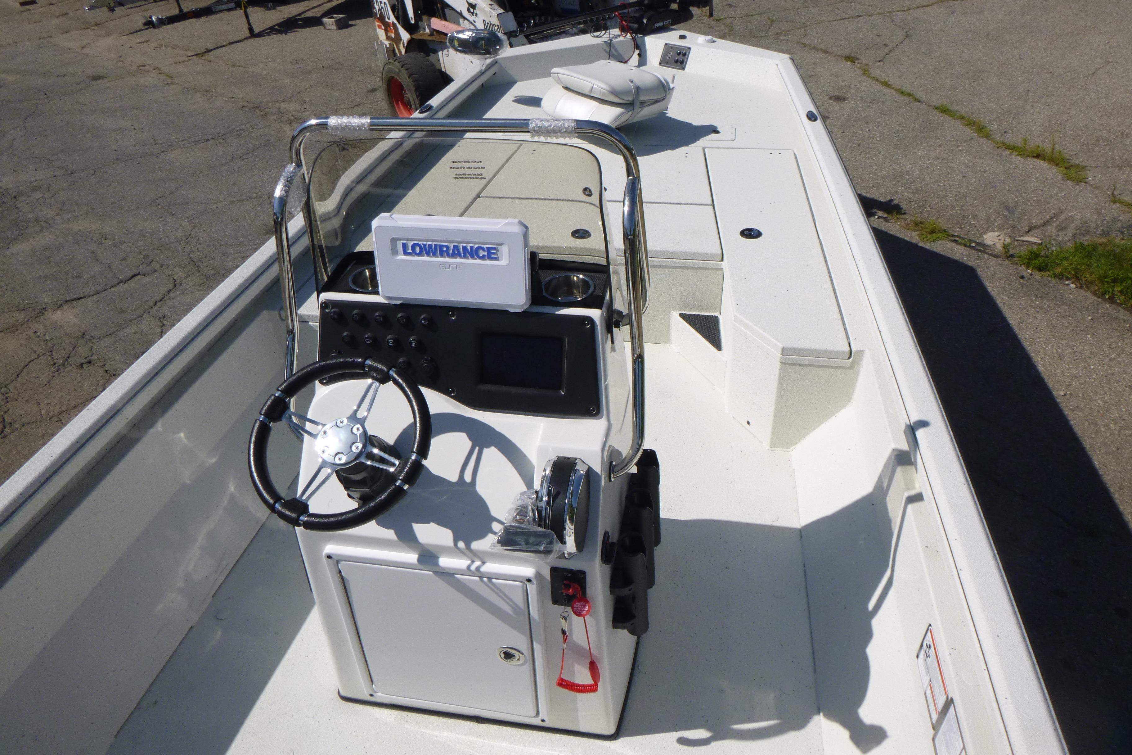 2025 Ranger RB210 boat interior with steering console and navigation equipment.