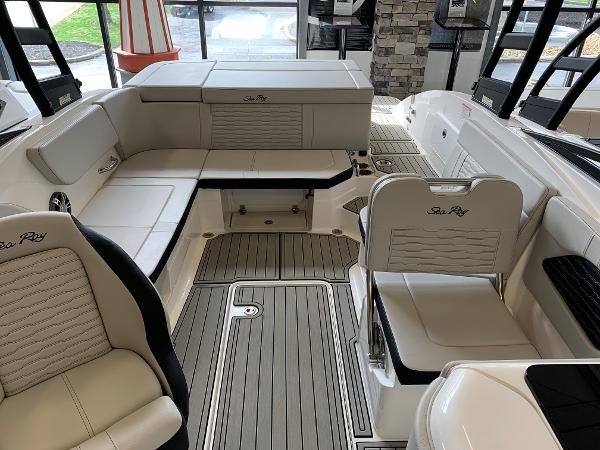 Luxurious interior of 2025 Sea Ray SPX 230 boat with elegant seating and modern design.