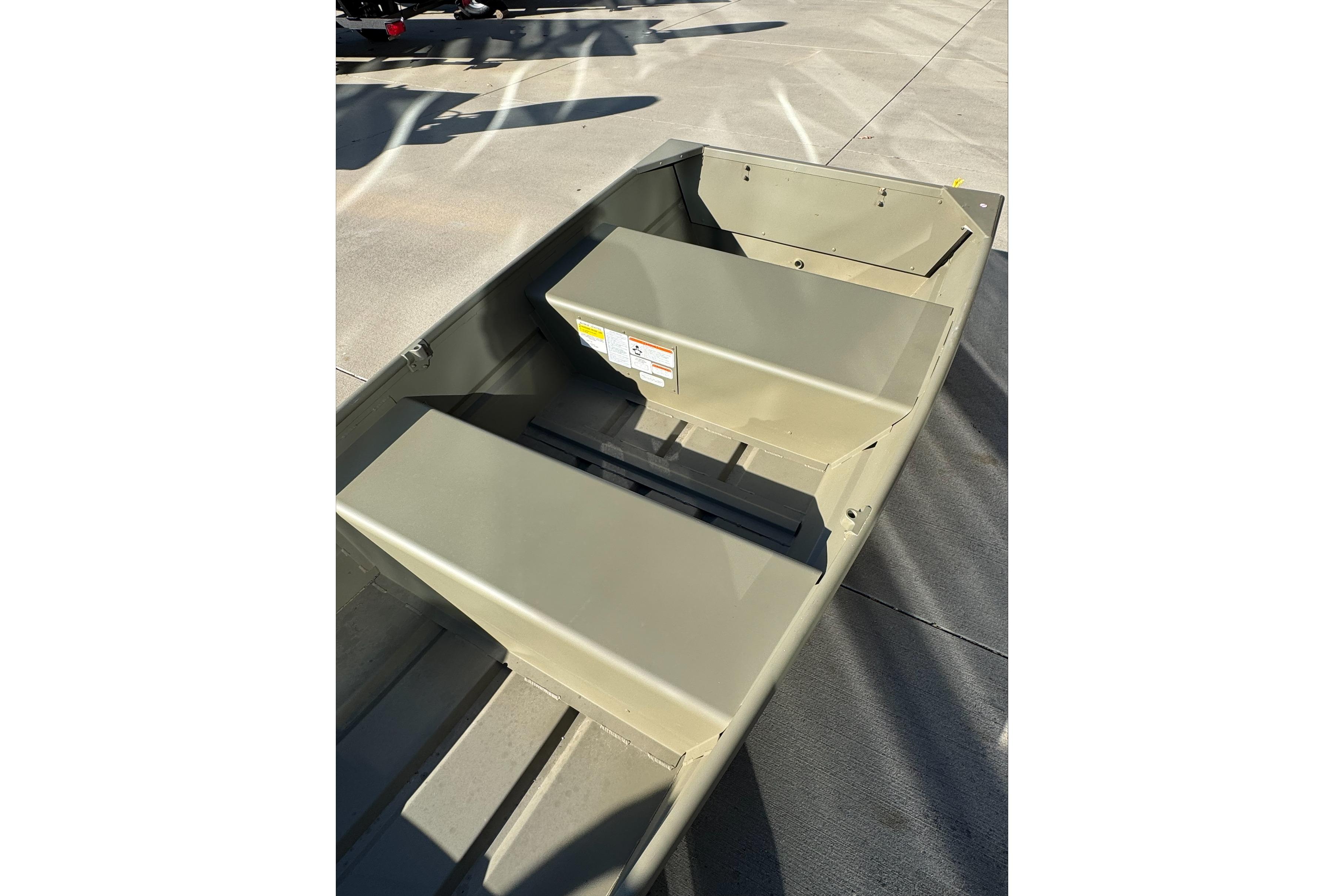 2026 Tracker Grizzly 10 Jon boat interior, showcasing seating and storage compartments.