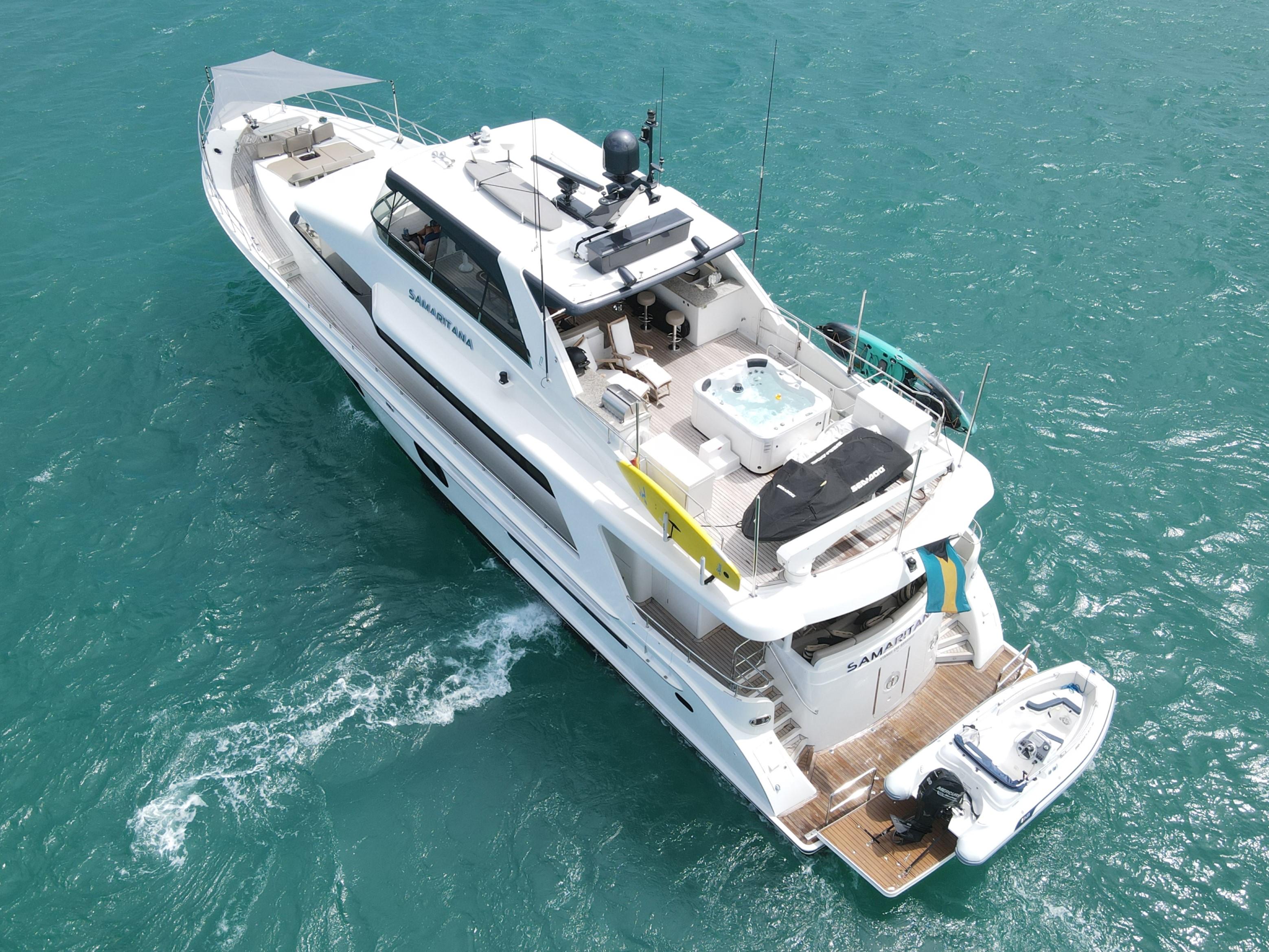 Luxurious 2013 Cheoy Lee Bravo yacht cruising on turquoise waters, aerial view.