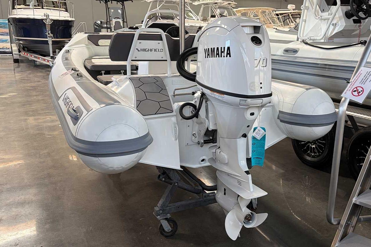 2026 Highfield Sport 460 boat with Yamaha engine displayed in showroom.