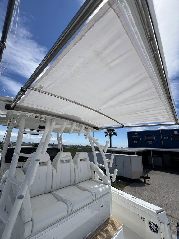2021 Regulator 41 boat with sunshade and seating area.