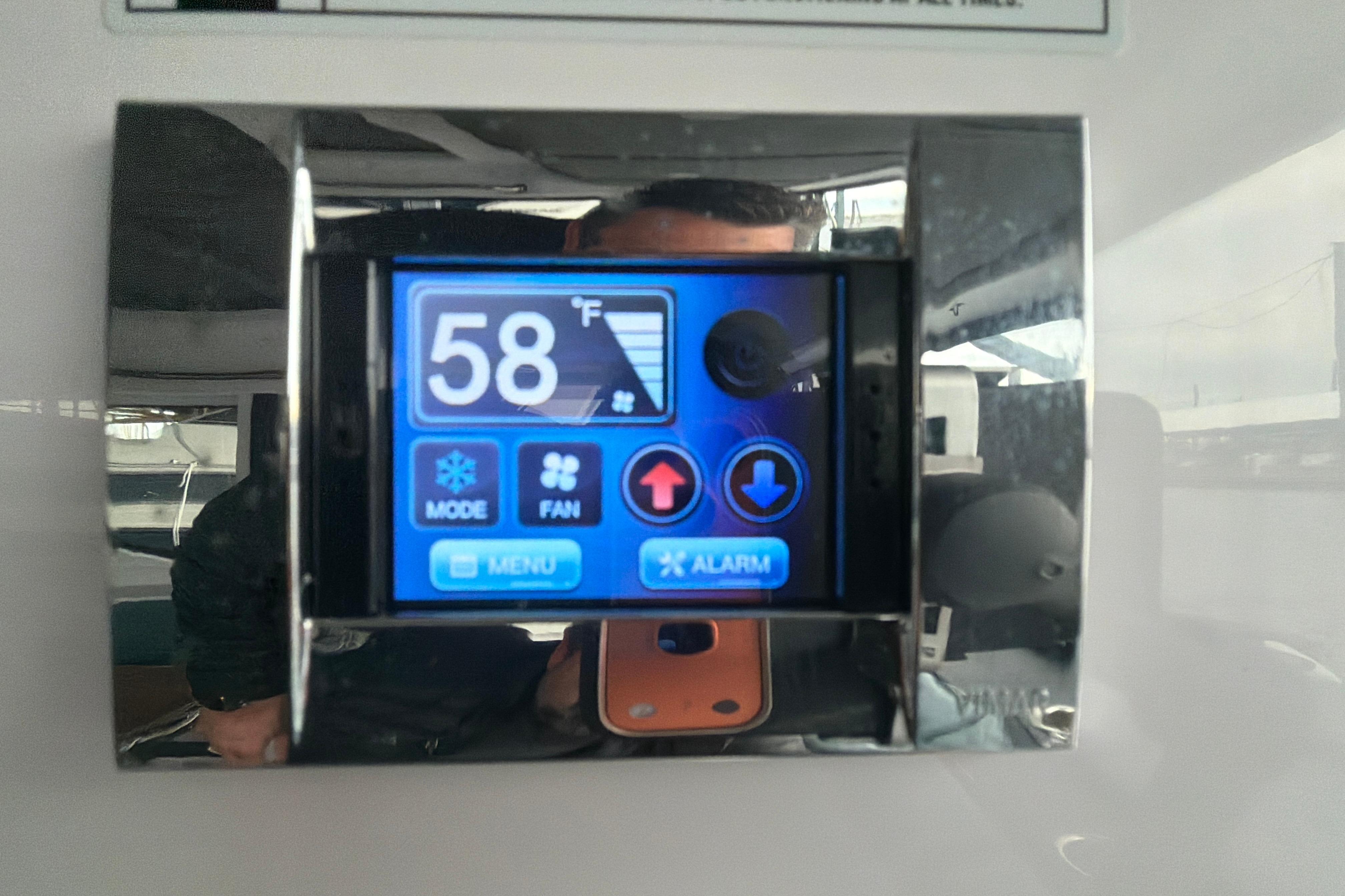 Digital control panel on 2022 Axopar Brabus 37 XC Cross Cabin displaying 58°F.