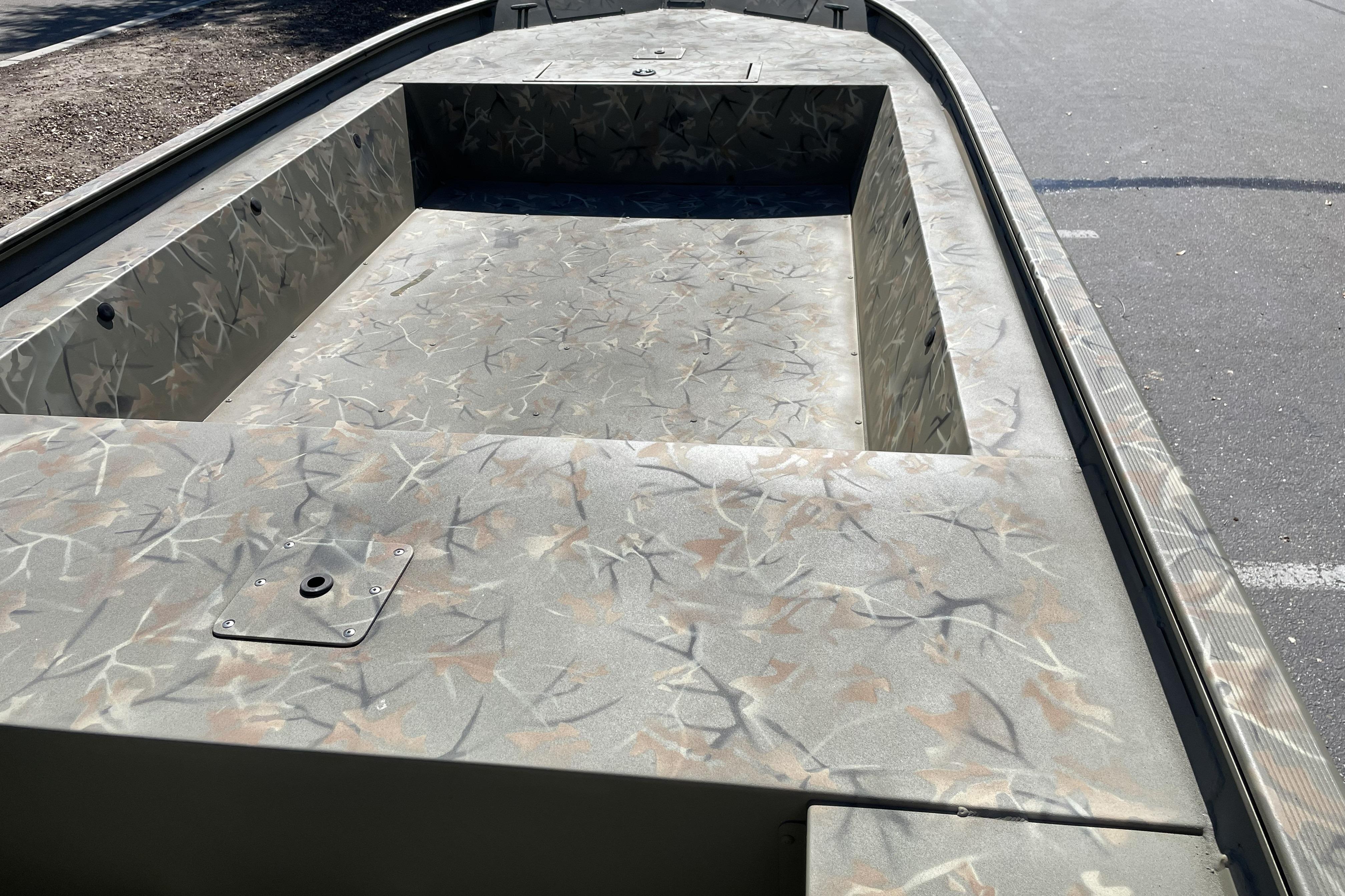 2025 Tracker Grizzly 1754 Jon boat with camouflage interior design.