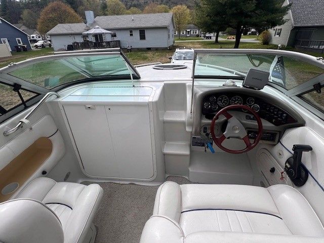 Interior of a 1999 Crownline 266 CCR boat with steering console.