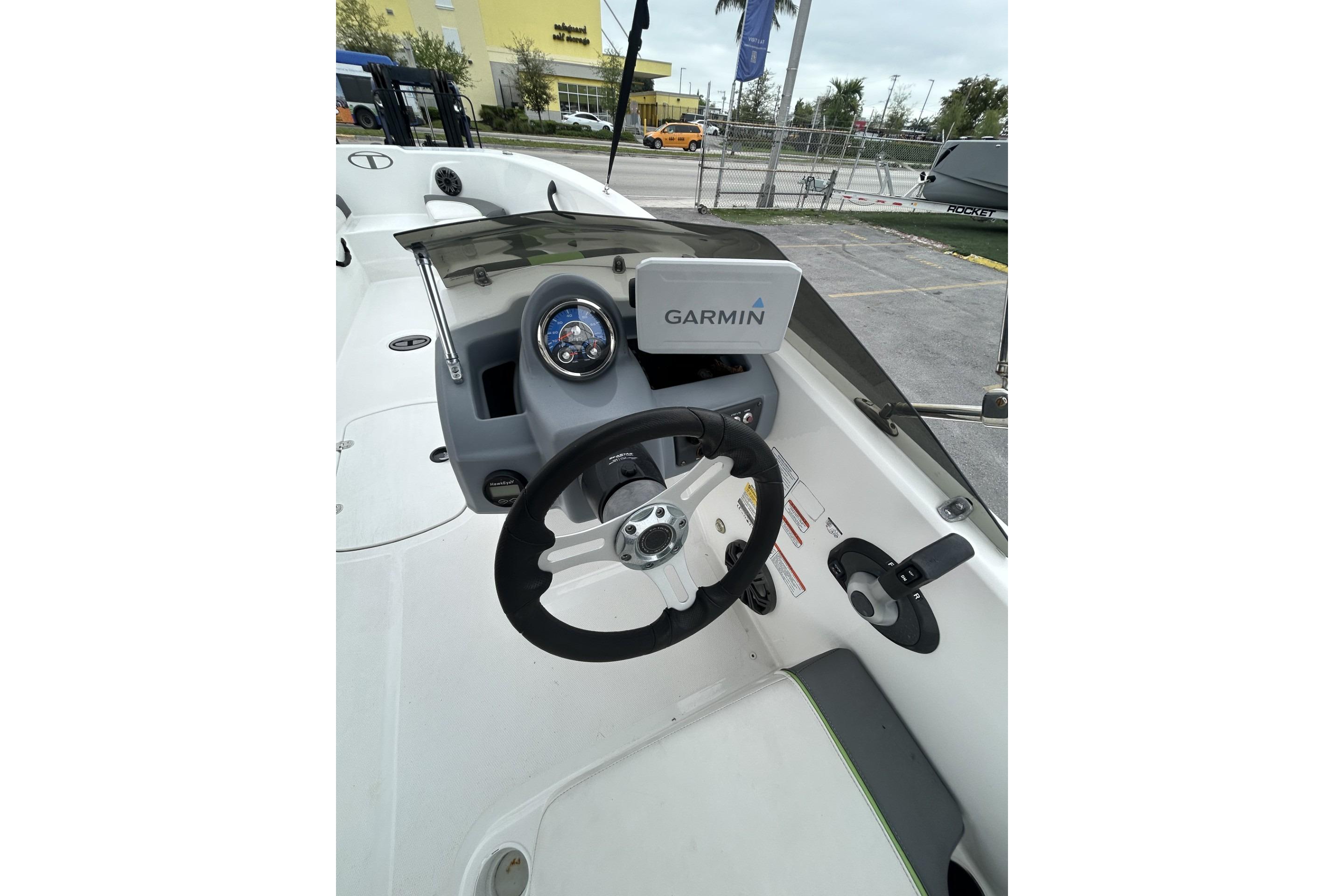 Steering console of 2022 Tahoe T18 boat with Garmin navigation system.