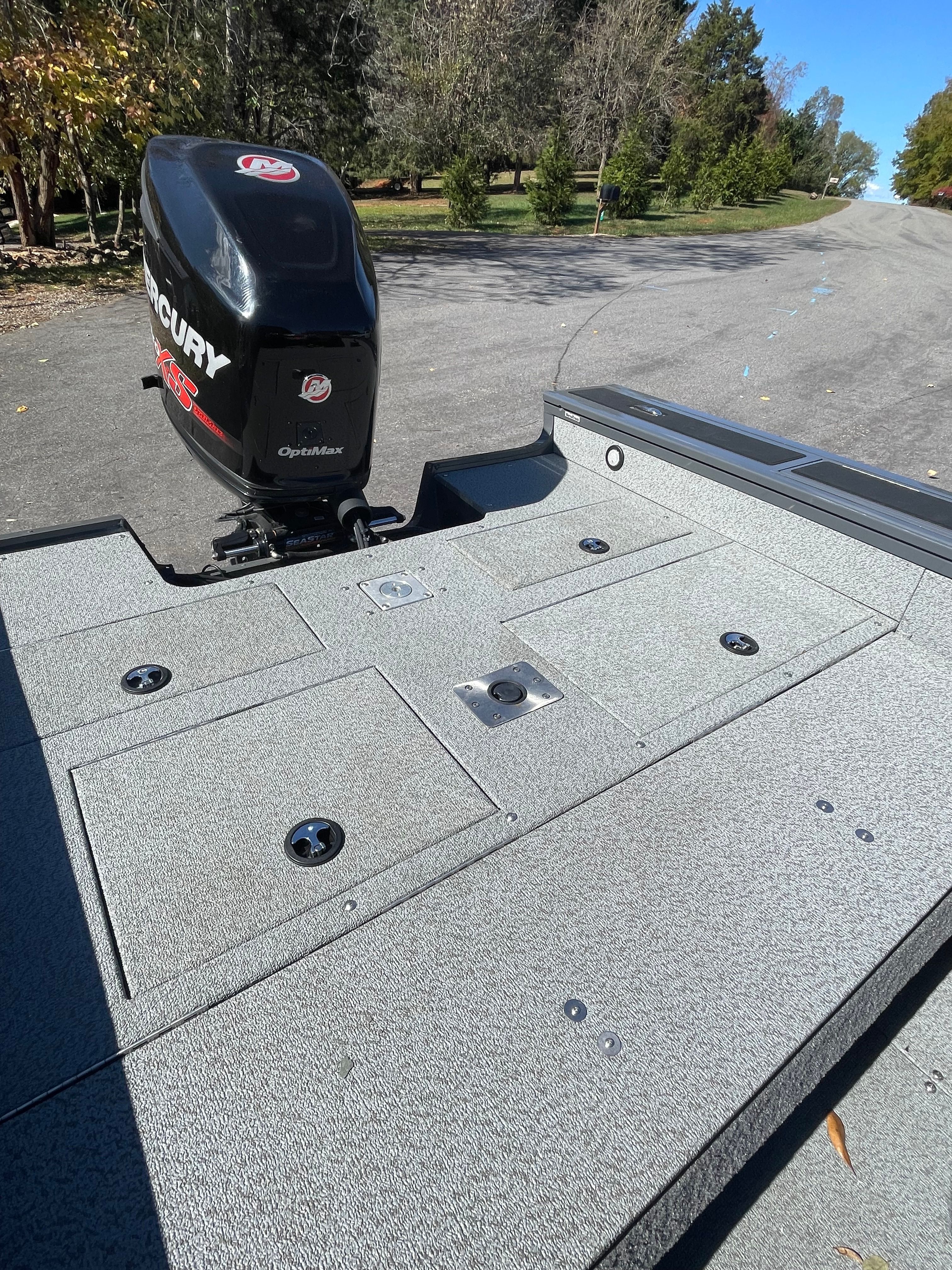 2017 Bass Tracker TARGA boat with Mercury engine on asphalt road.