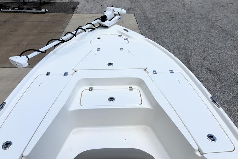2025 Key West 210 Bay Reef boat deck with trolling motor, parked on concrete.