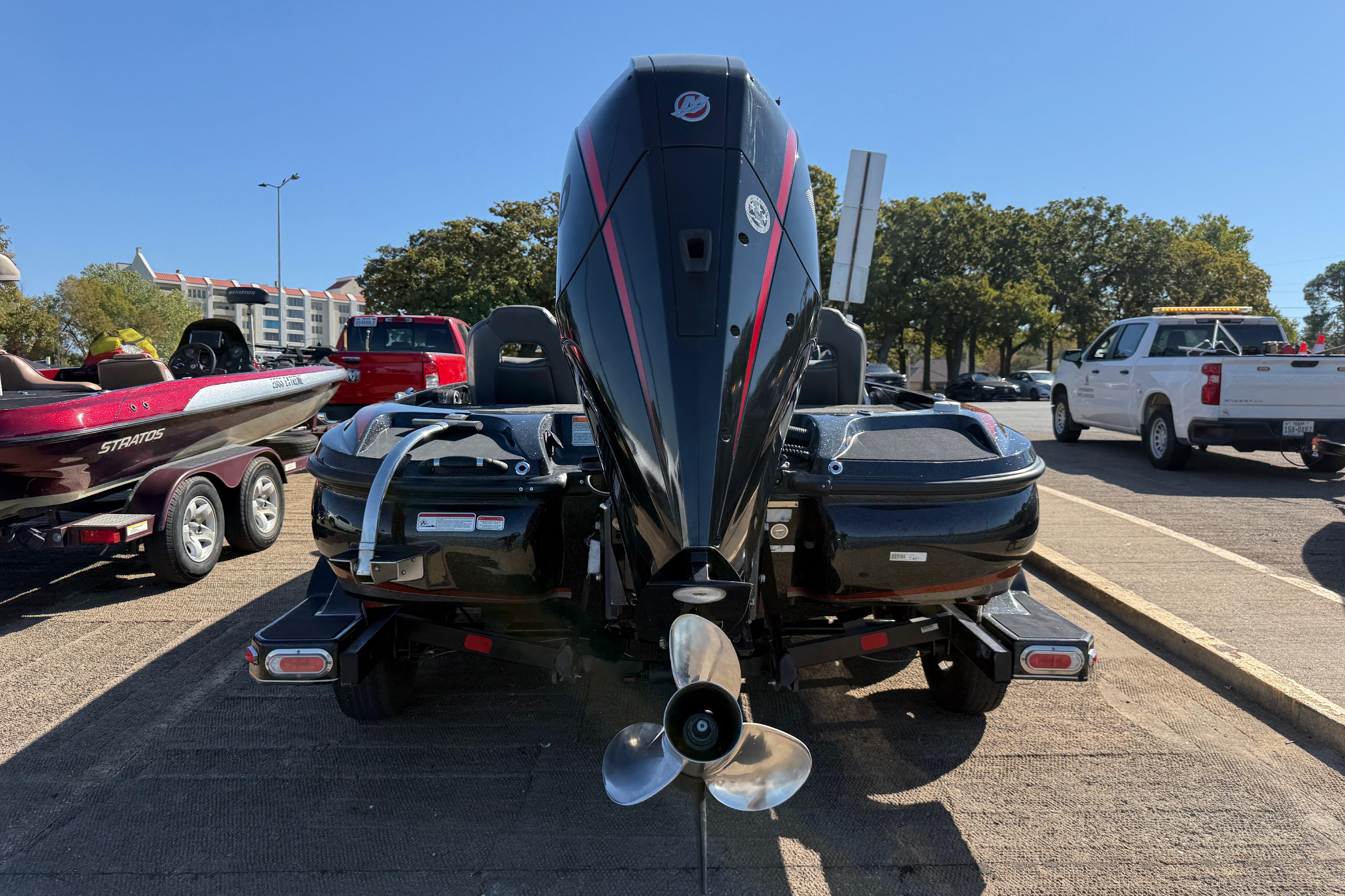 2019 Nitro Z21 Pro boat on trailer, rear view, parked outdoors.
