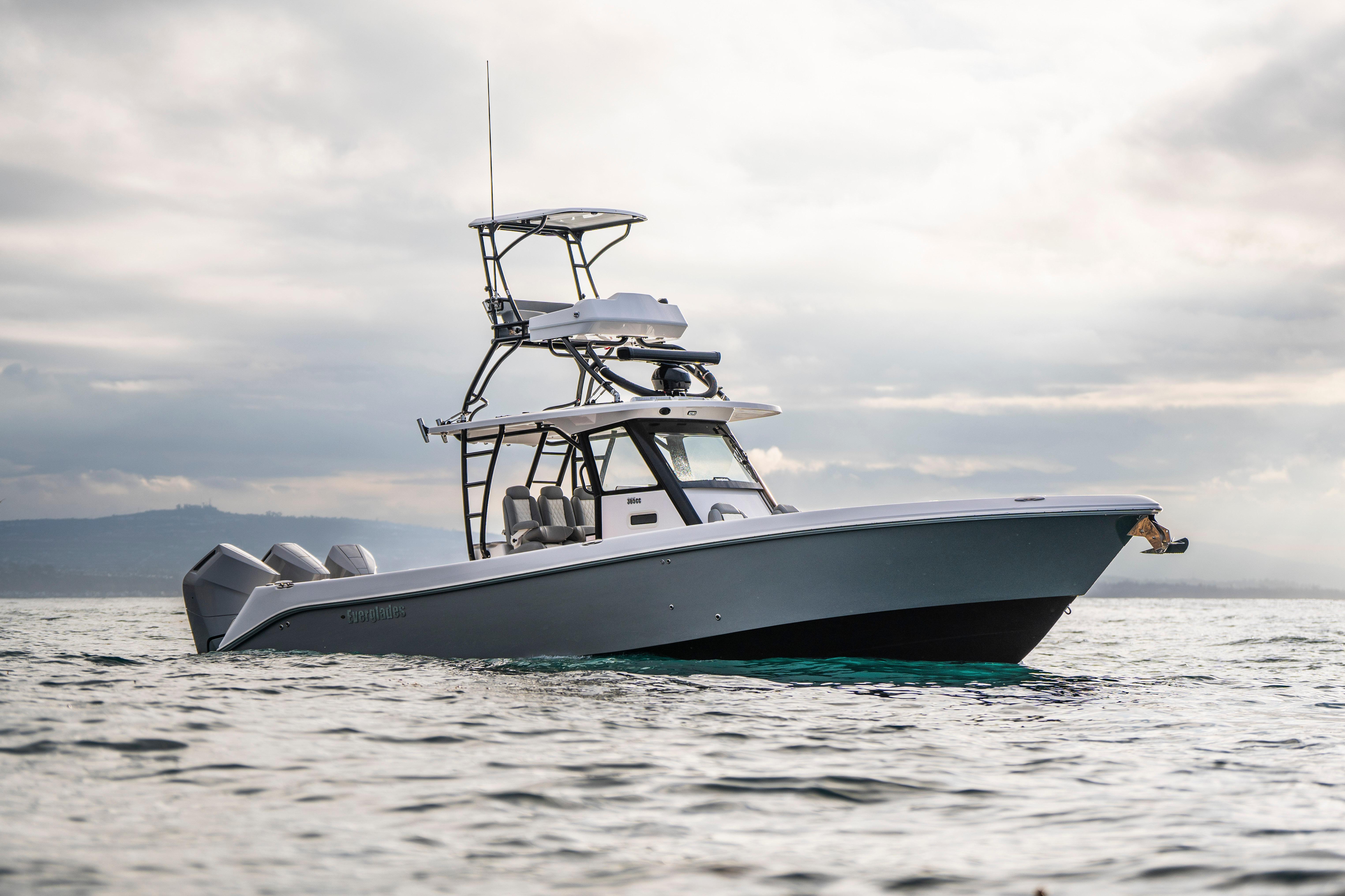 2024 Everglades 365 Center Console boat on open water under cloudy sky.