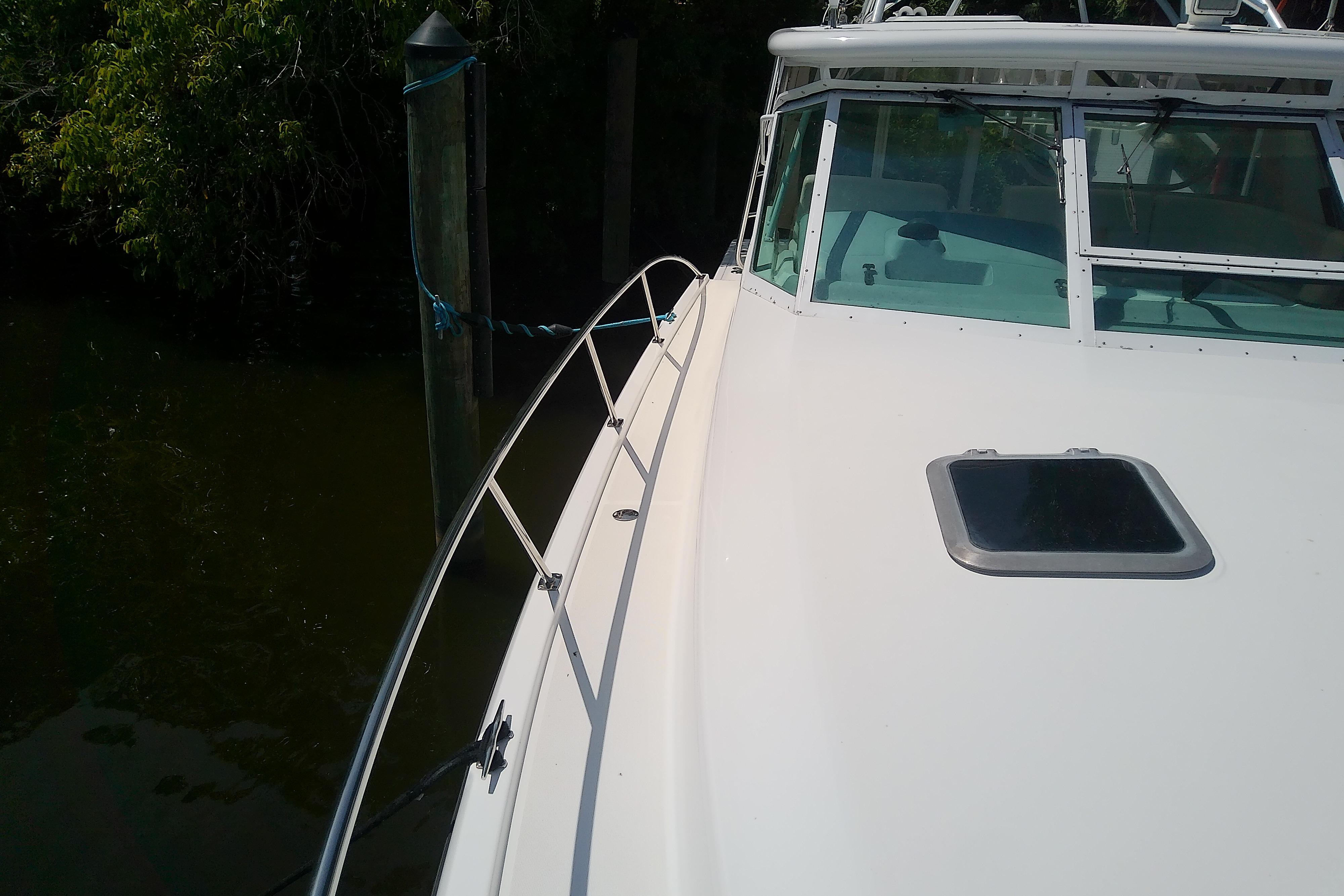 2000 Tiara Yachts 4100 Open boat docked, showcasing sleek deck and windshield design.