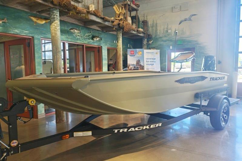 2026 Tracker Grizzly 1650 T Prairie Wings Edition boat displayed indoors on a trailer.