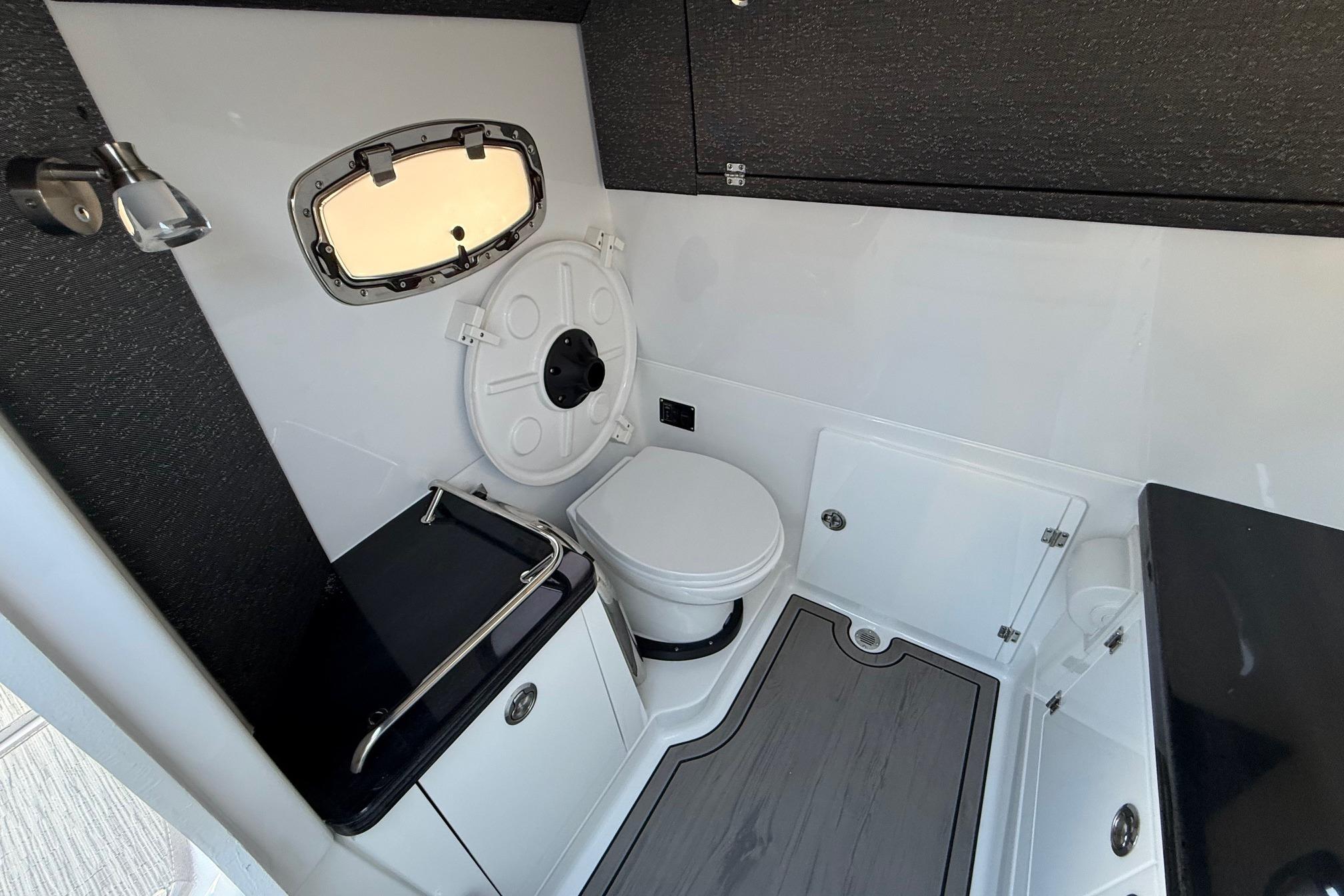 Interior of 2026 Monterey Elite 30 OB with toilet and window.
