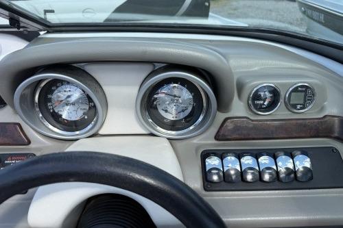 Dashboard of a 2012 Crownline 215 SS boat with gauges and controls.