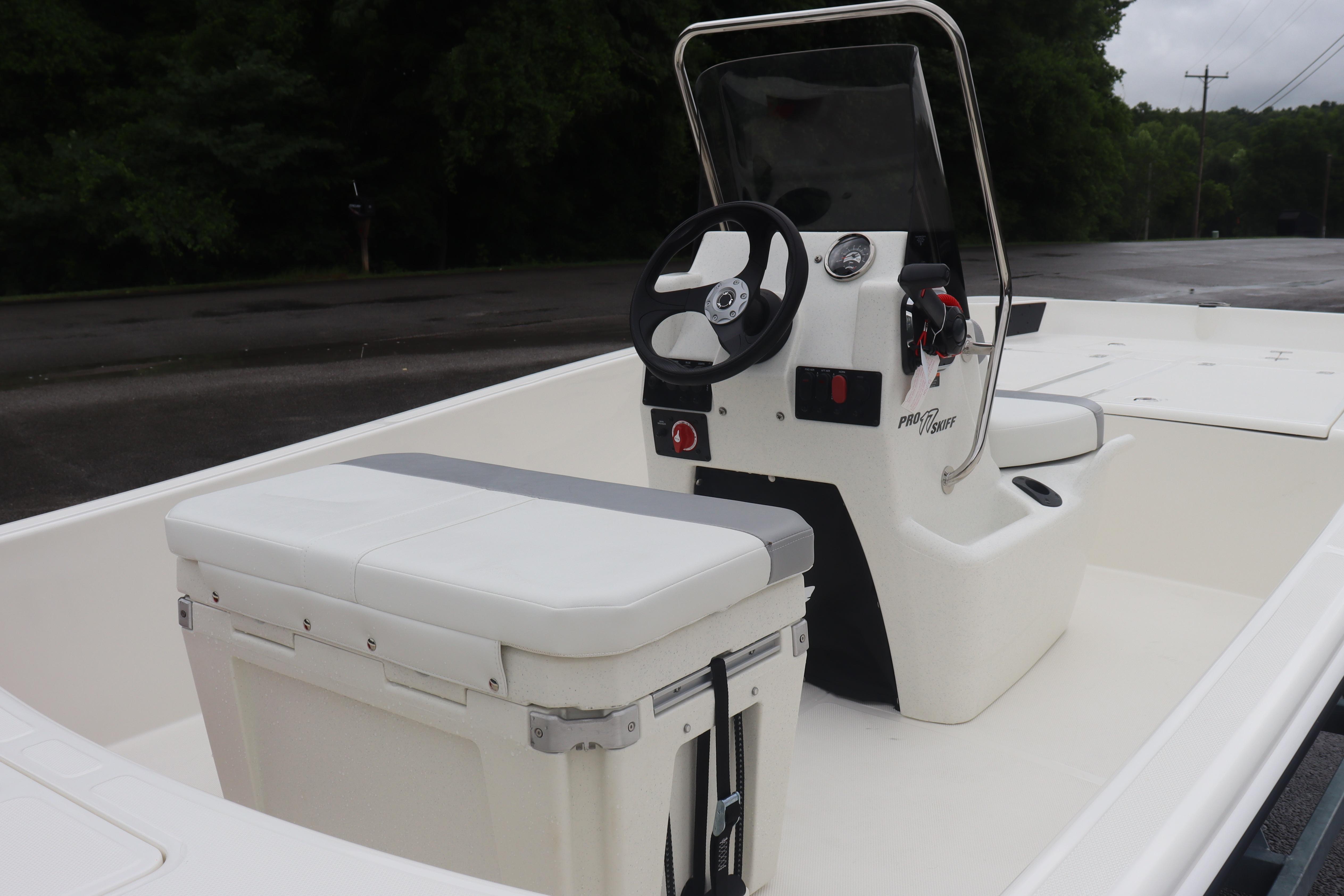 2026 Mako Pro Skiff 17 CC boat interior with steering console and seating.