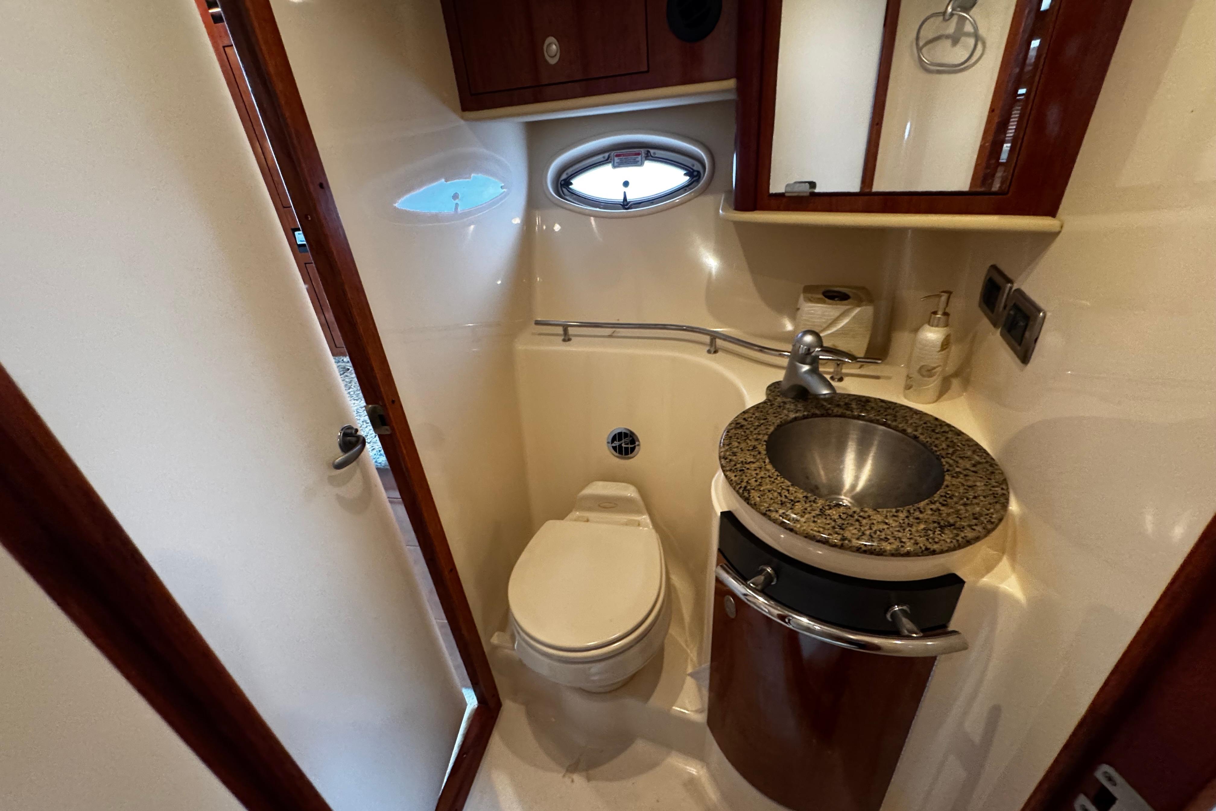 Luxurious bathroom in 2006 Sea Ray 40 Sundancer yacht with modern fixtures.