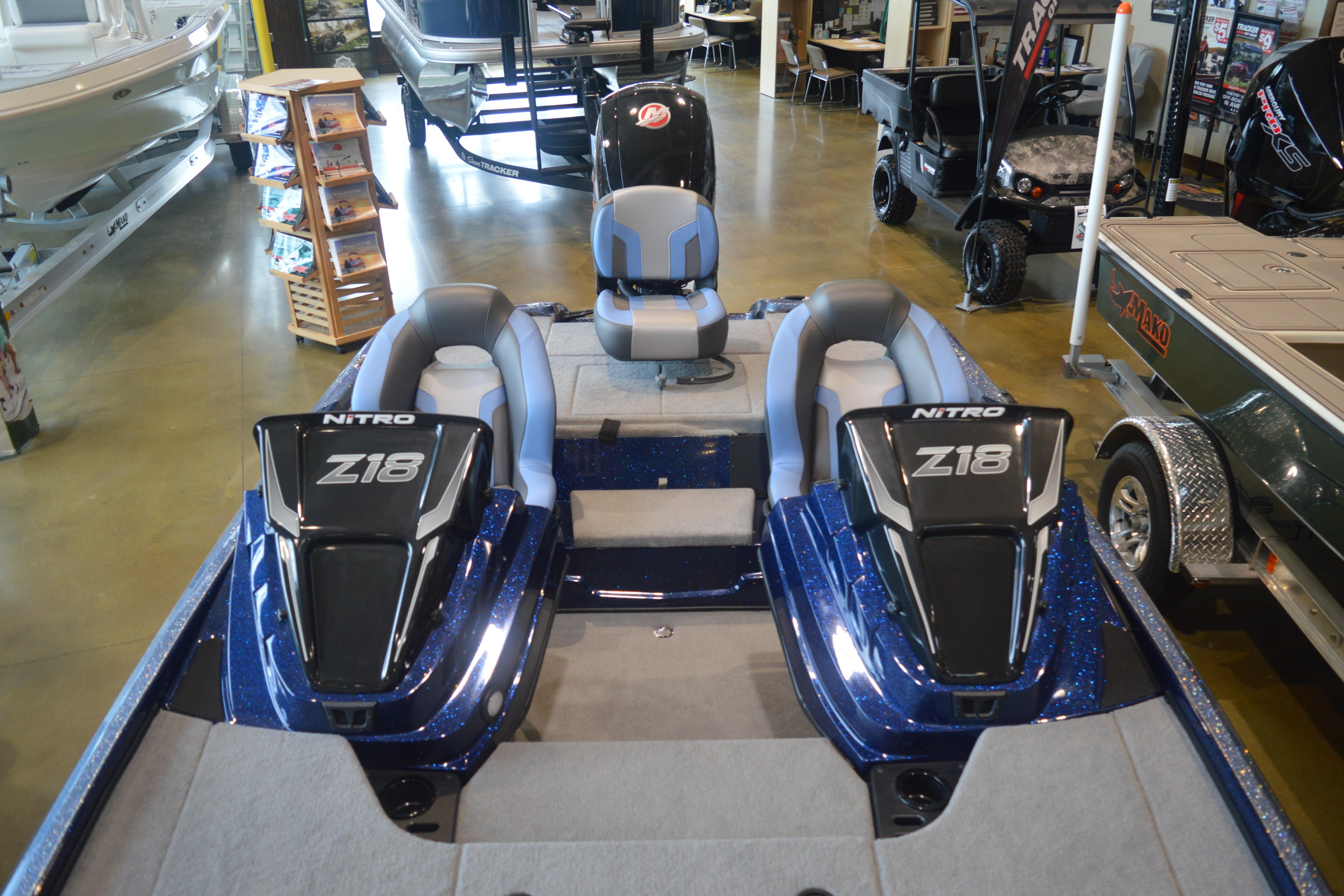 2026 Nitro Z18 Pro boat with dual seats in showroom, featuring sleek design and modern features.