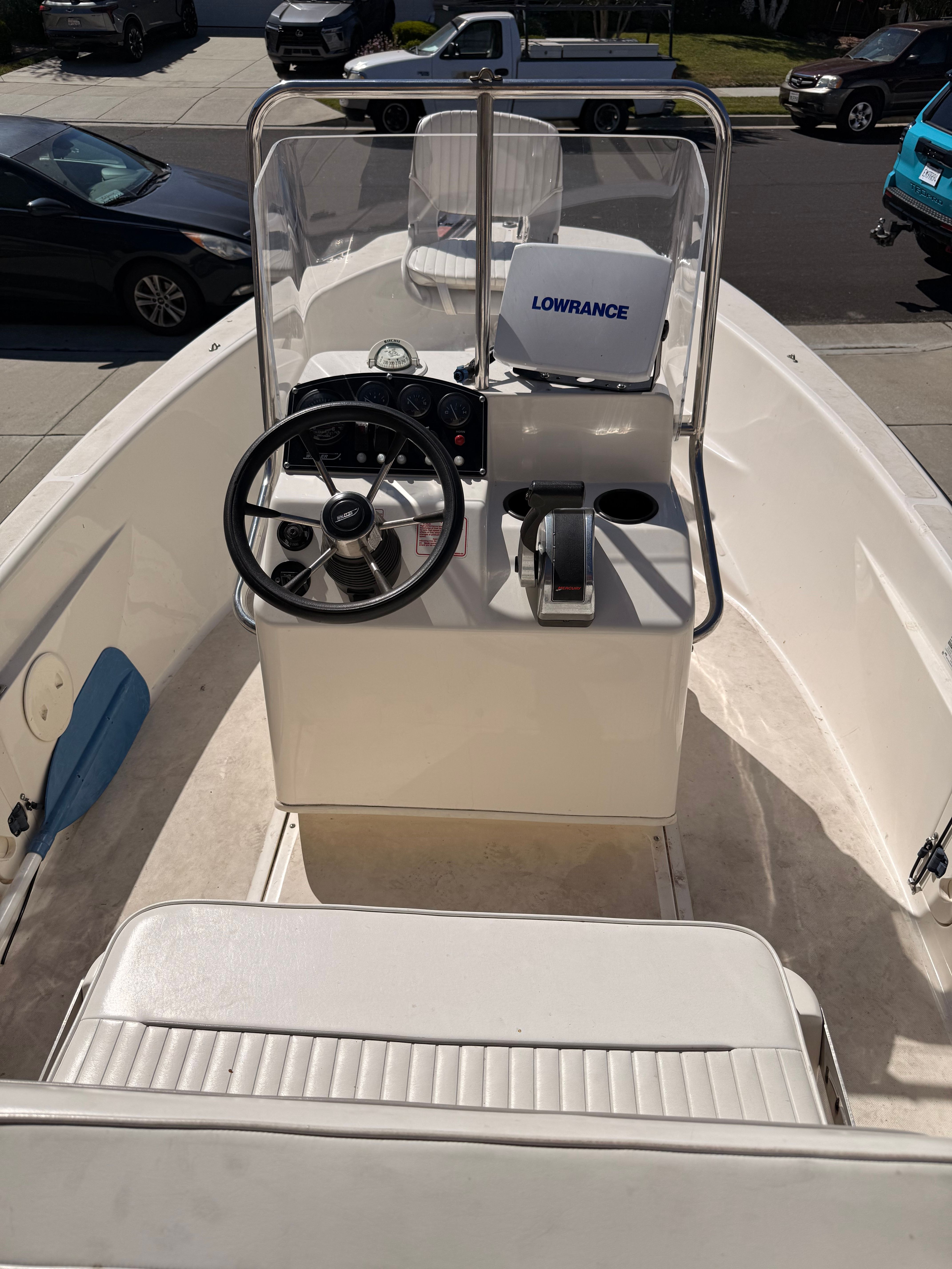 Interior view of a 2002 Boston Whaler 160 Dauntless with helm and seating.