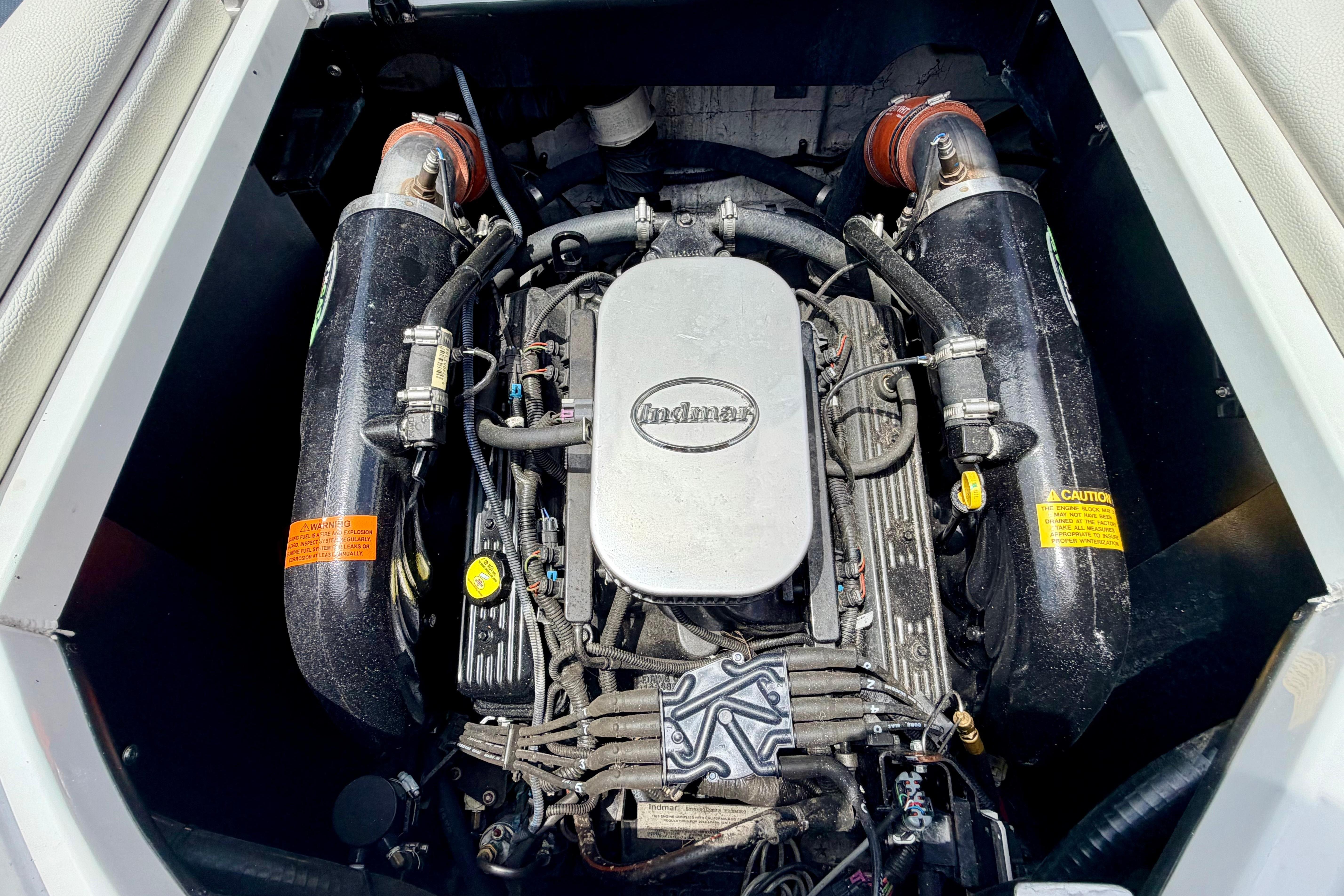 Engine compartment of a 2014 Tigé R20 boat with visible engine.