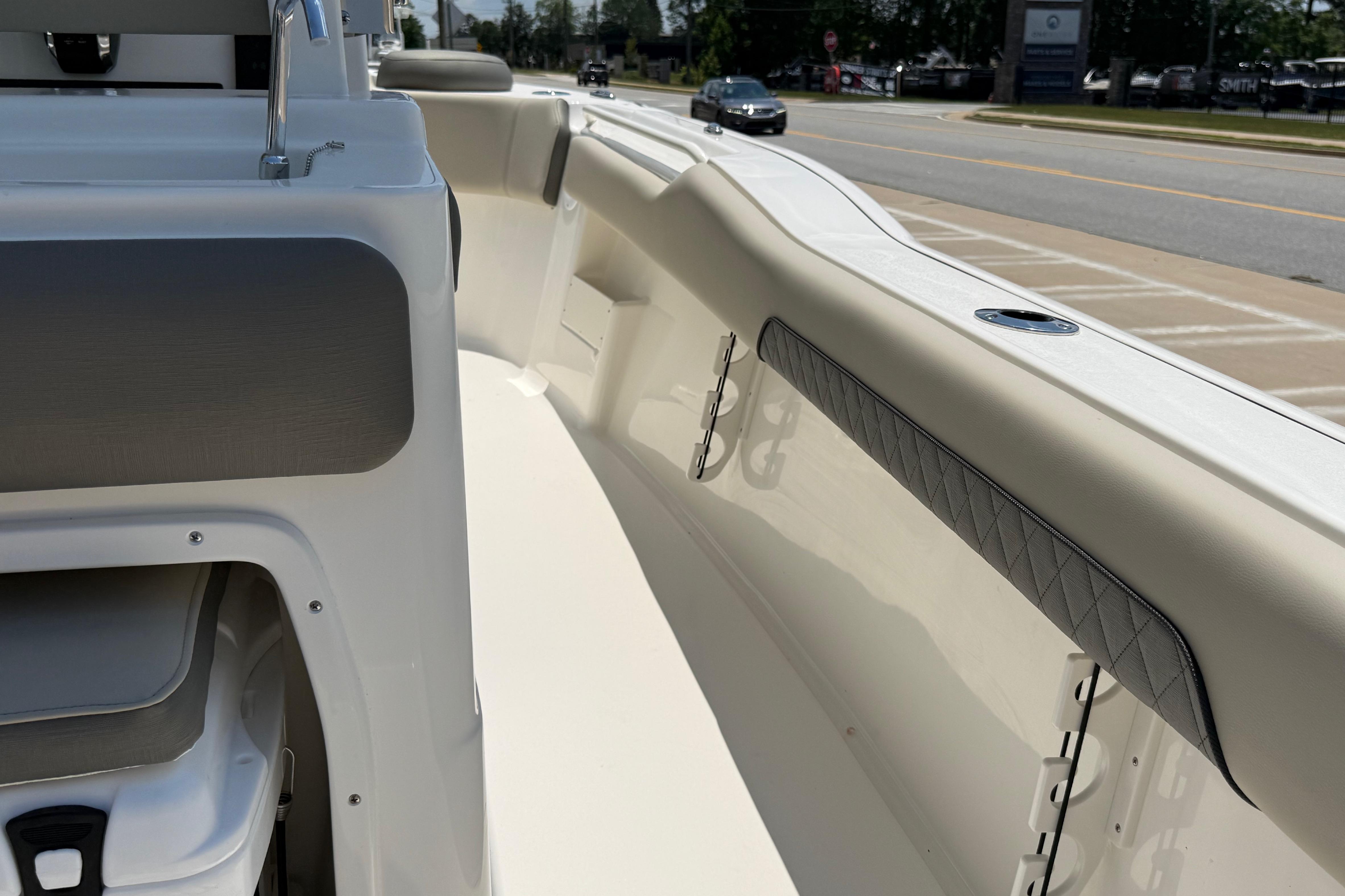 Interior view of 2027 Key West 249 FS boat, showcasing seating and sleek design.
