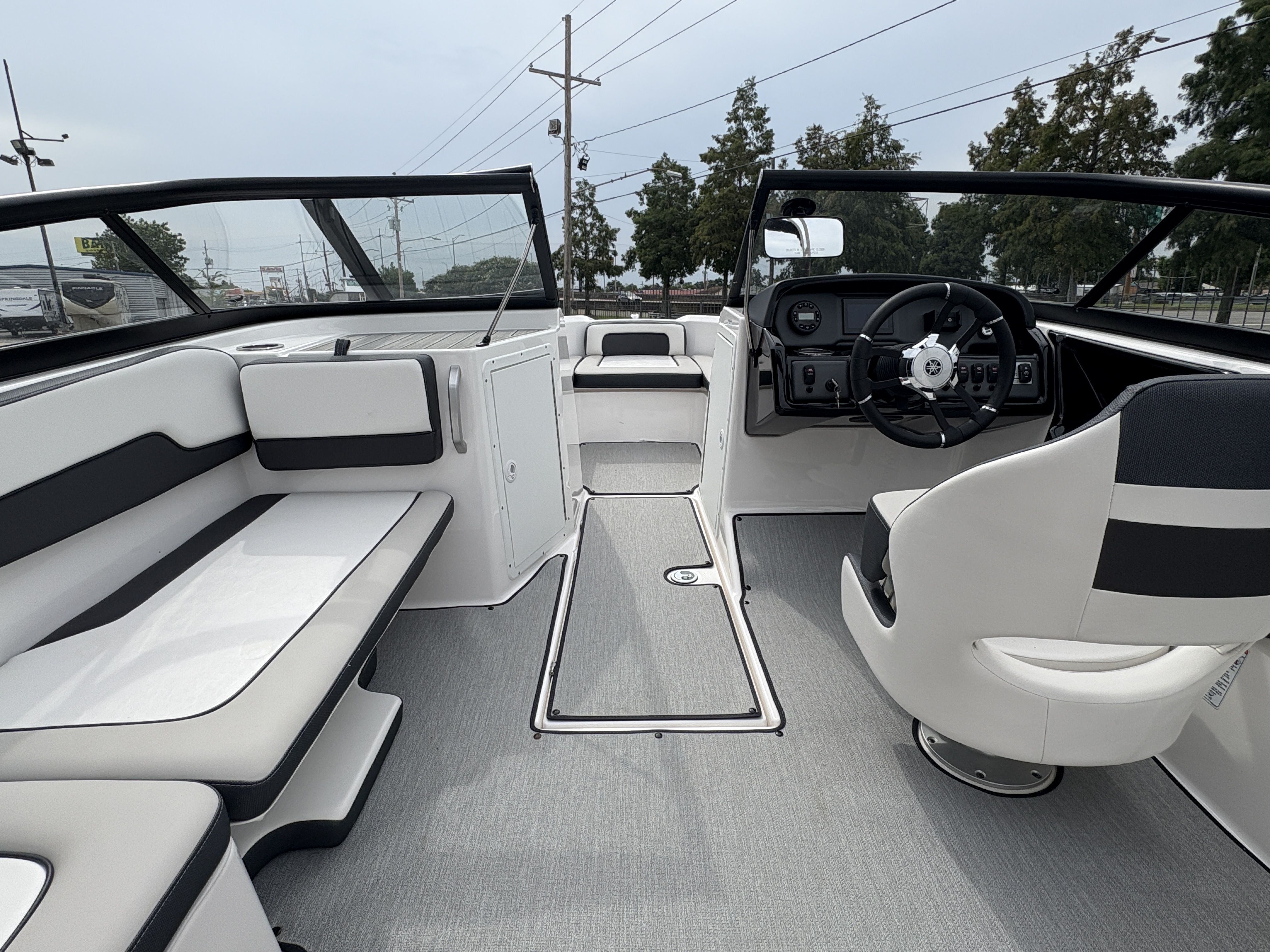 2024 Yamaha Boats AR 195 interior with sleek seating and modern dashboard design.