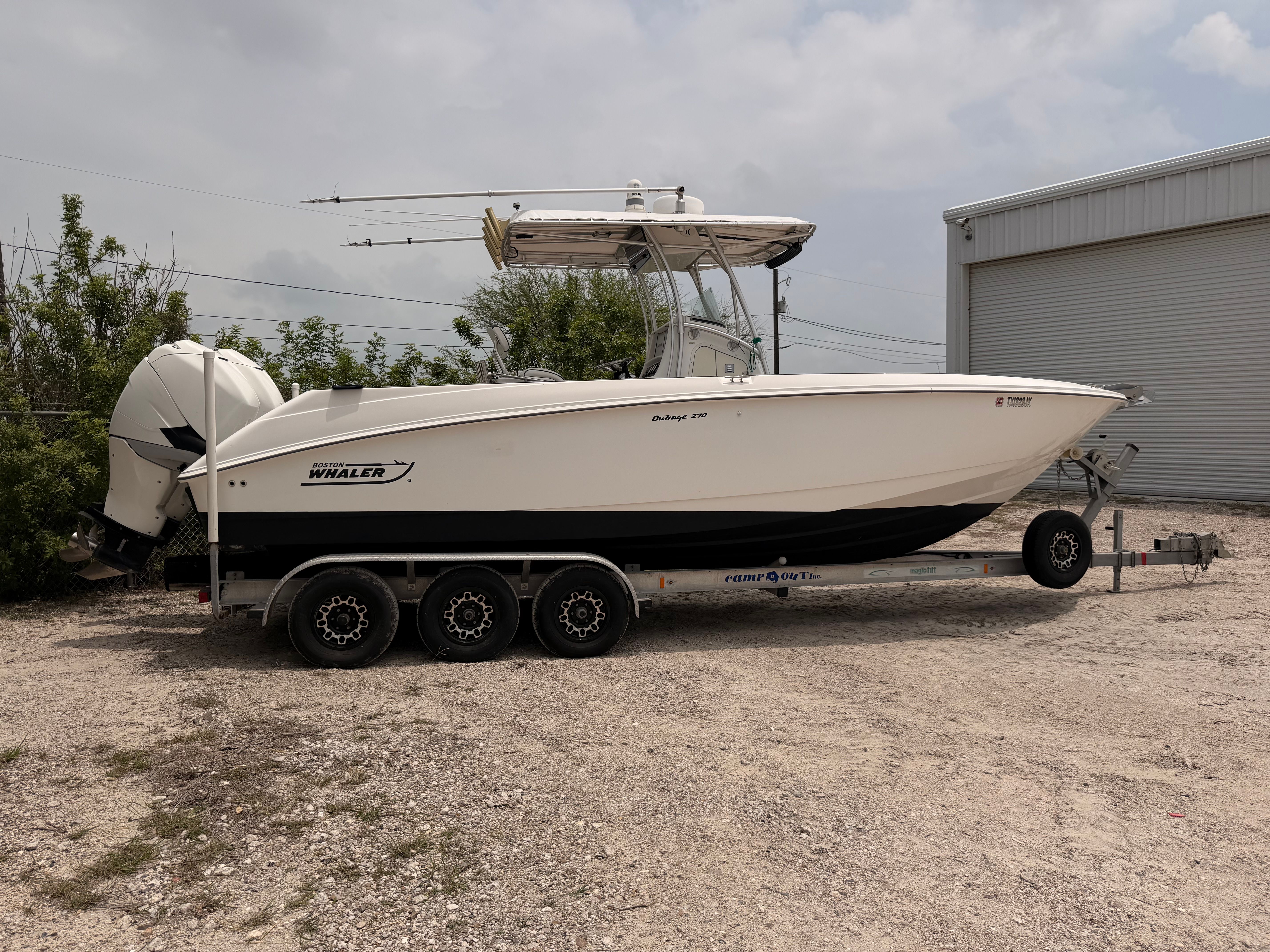 2002 Boston Whaler Outrage 270 on trailer, side view.