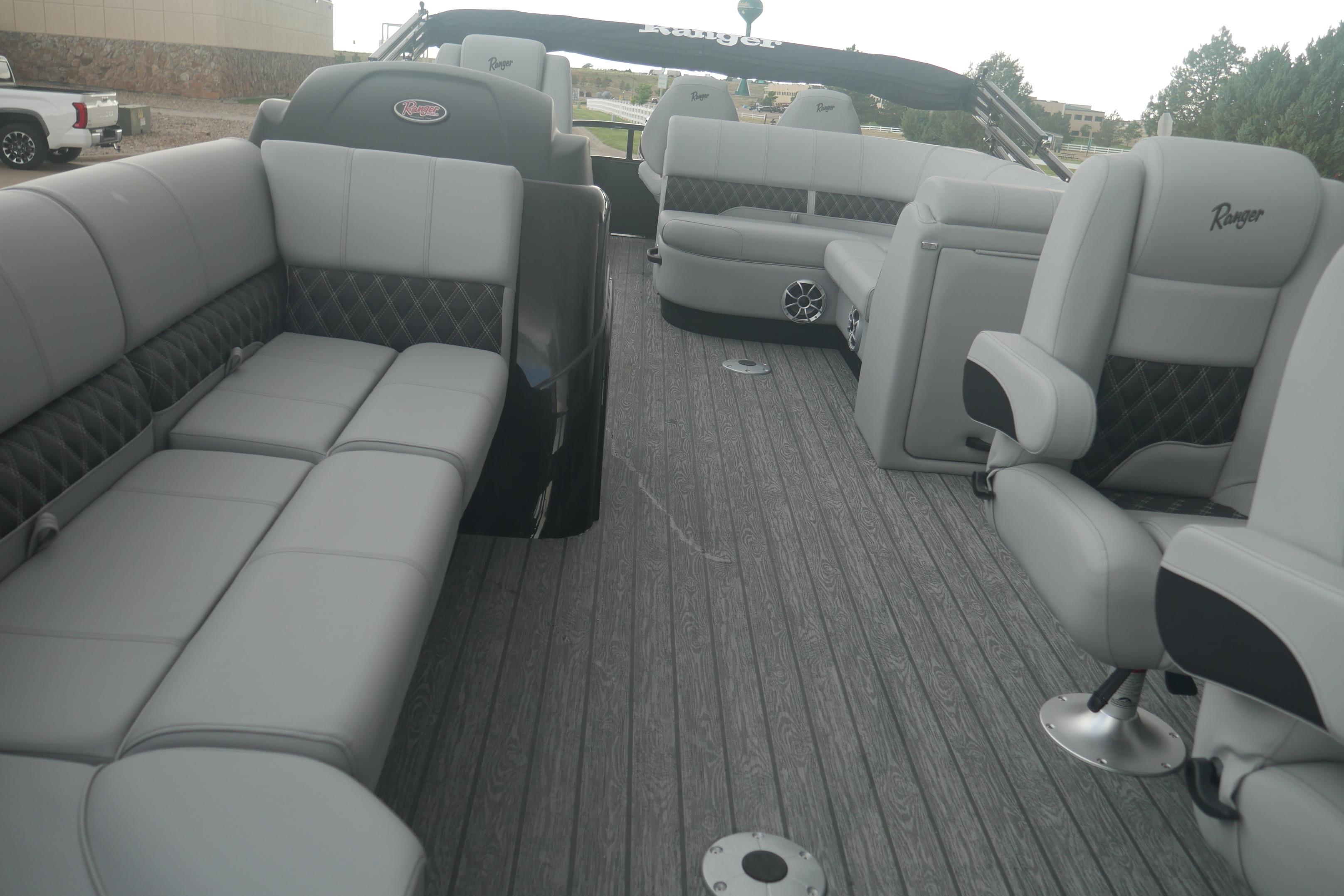 Luxurious interior of 2026 Ranger 220FC boat with plush seating and modern design.