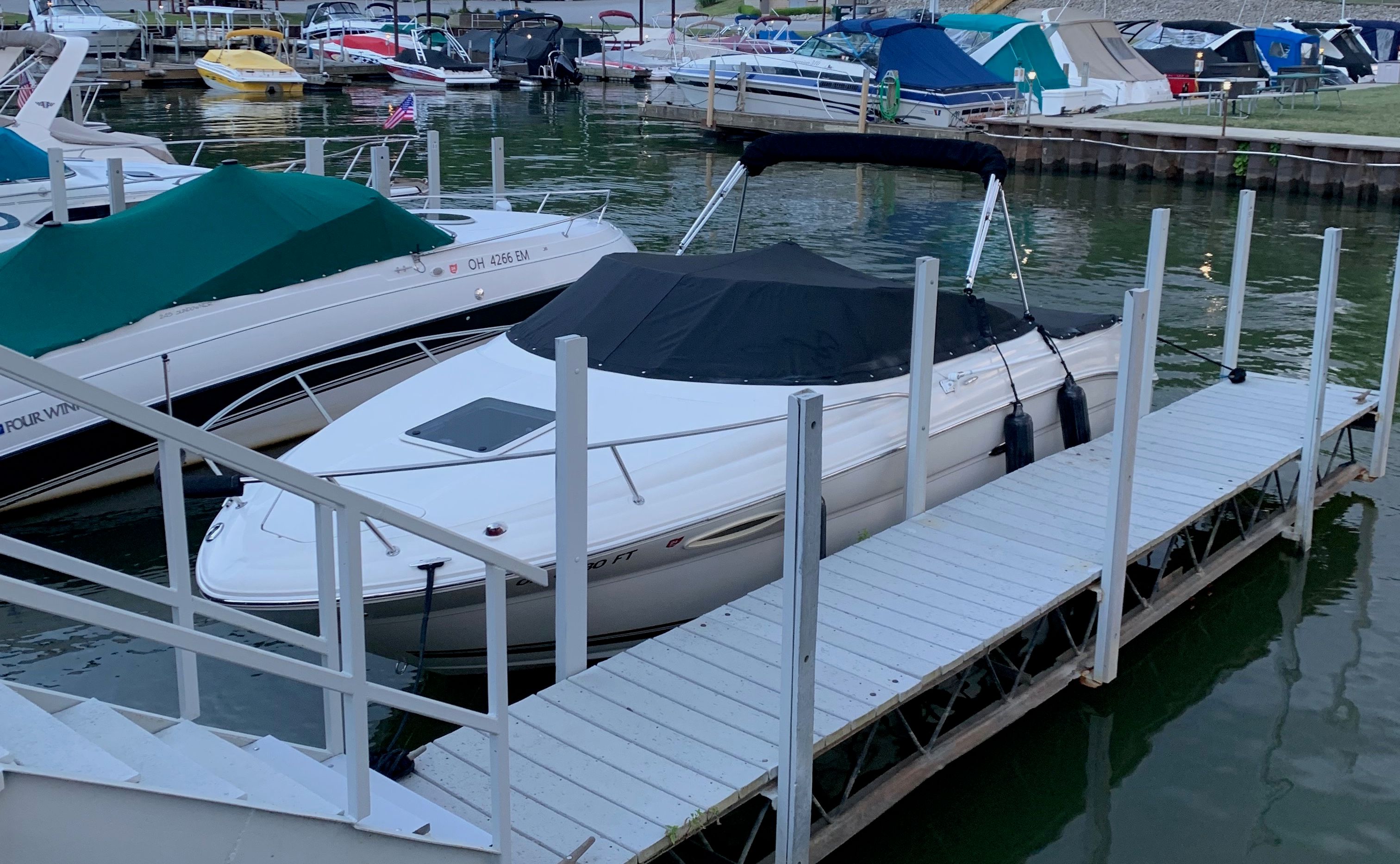 2006 Sea Ray 215 Weekender docked at marina.