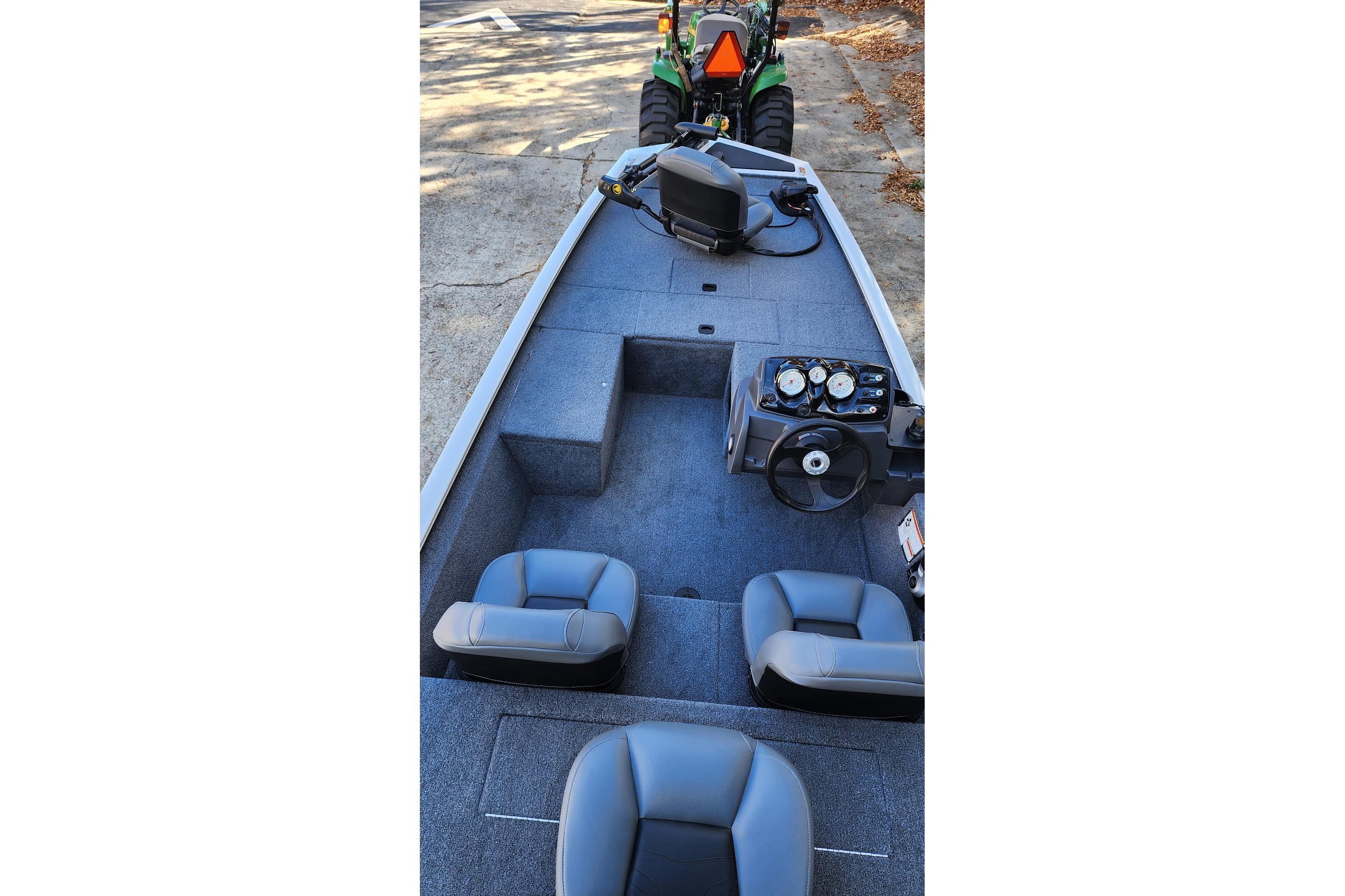 2026 Tracker Pro 170 boat interior with steering console and seating.