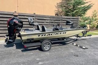 2026 Tracker Pro Team 190 boat on trailer, parked outdoors.