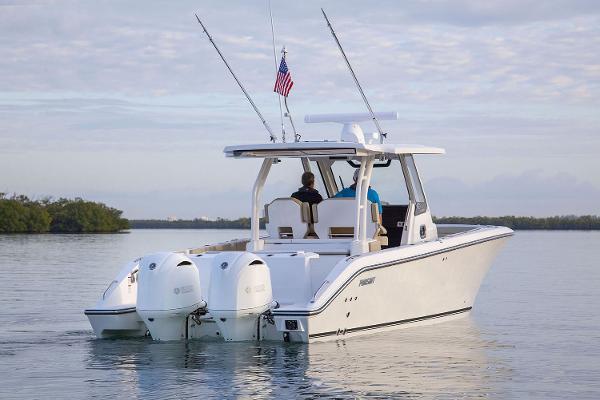Manufacturer Provided Image: 2023 Pursuit S 328 Sport boat cruising on calm water.