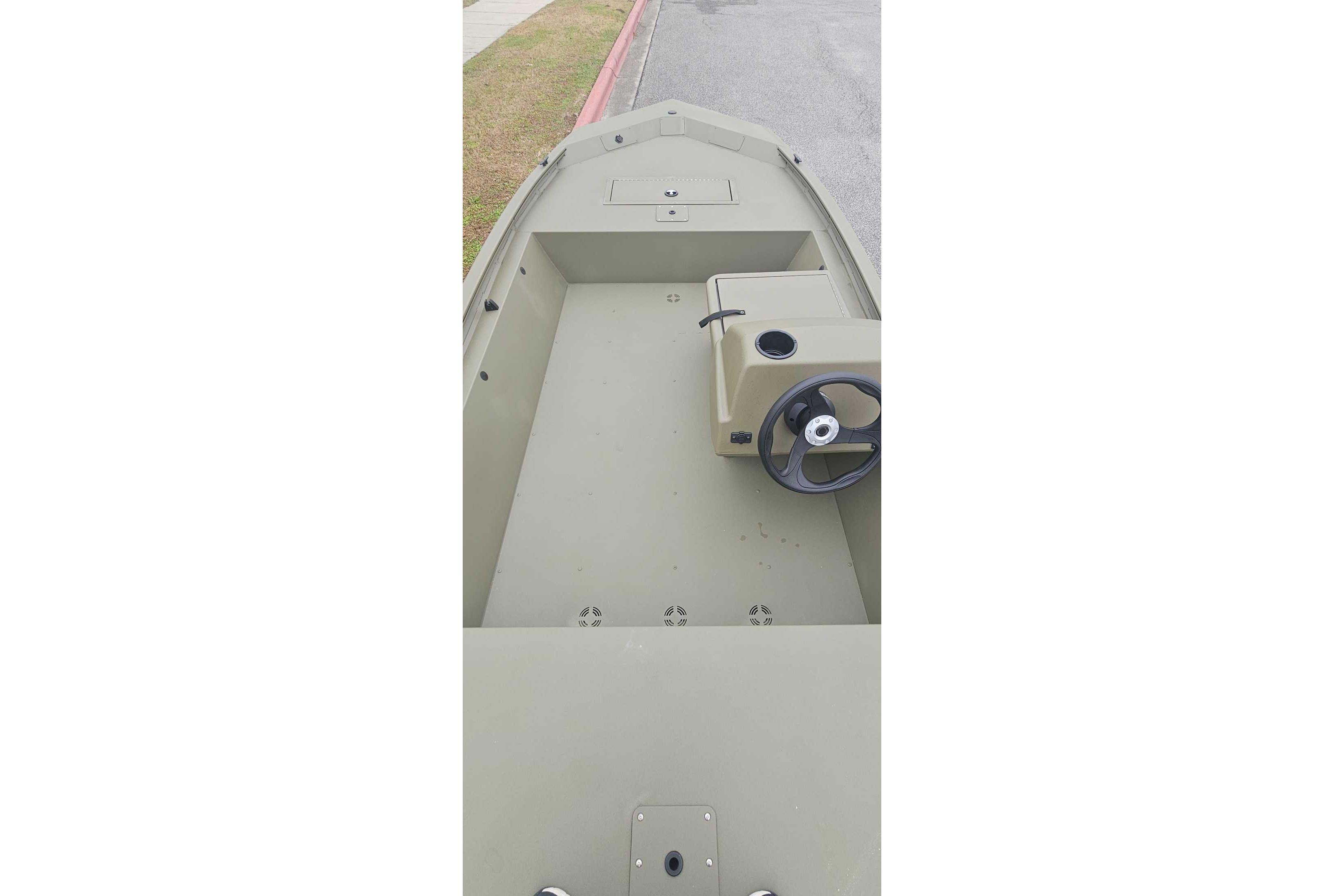 2026 Tracker Grizzly 1648 SC boat interior with steering console, viewed from above.
