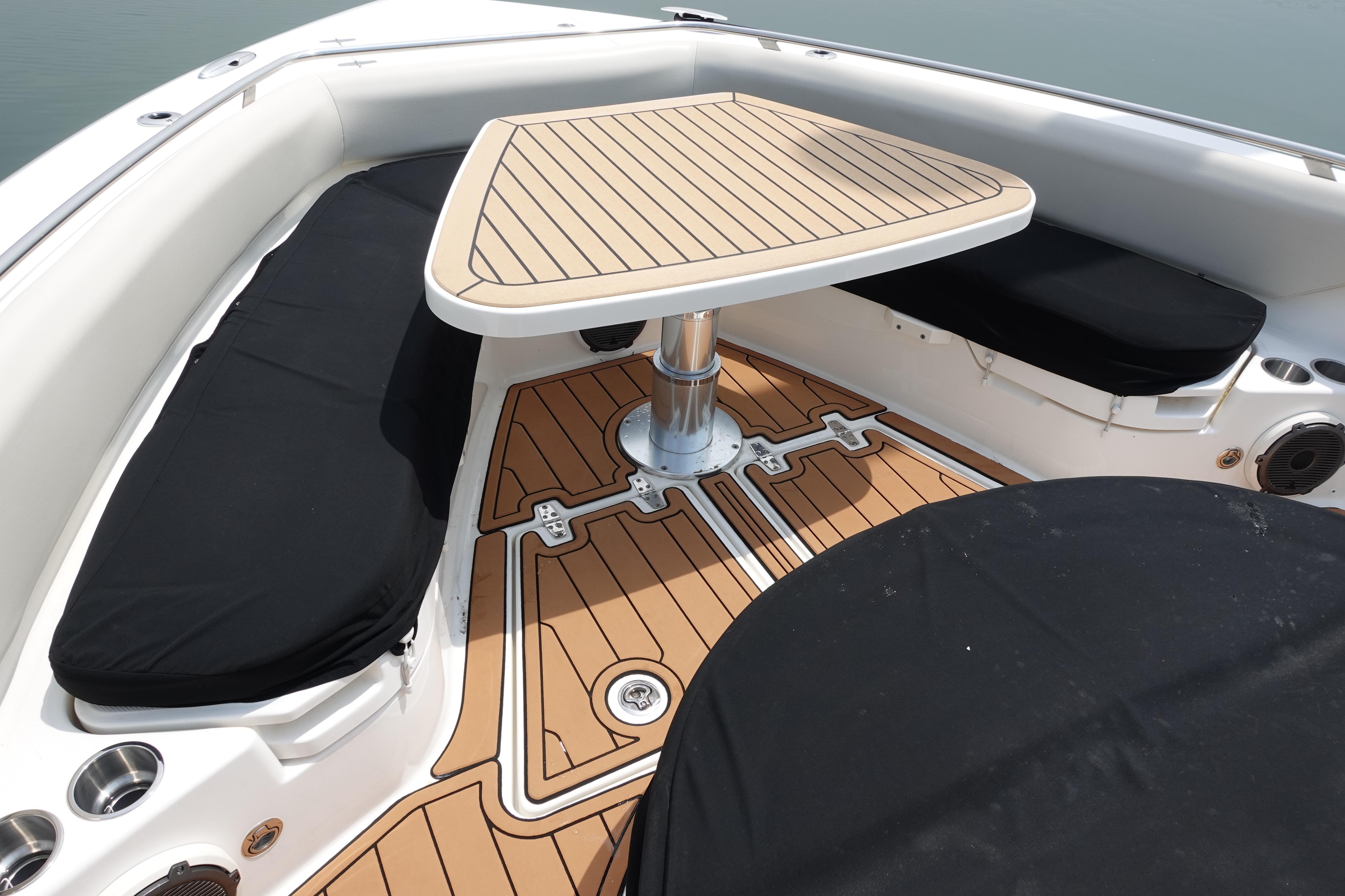2020 Boston Whaler 420 Outrage boat interior with sleek seating and stylish table design.