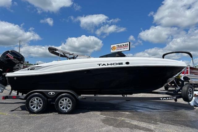 2026 Tahoe T21 boat on trailer under blue sky with clouds.