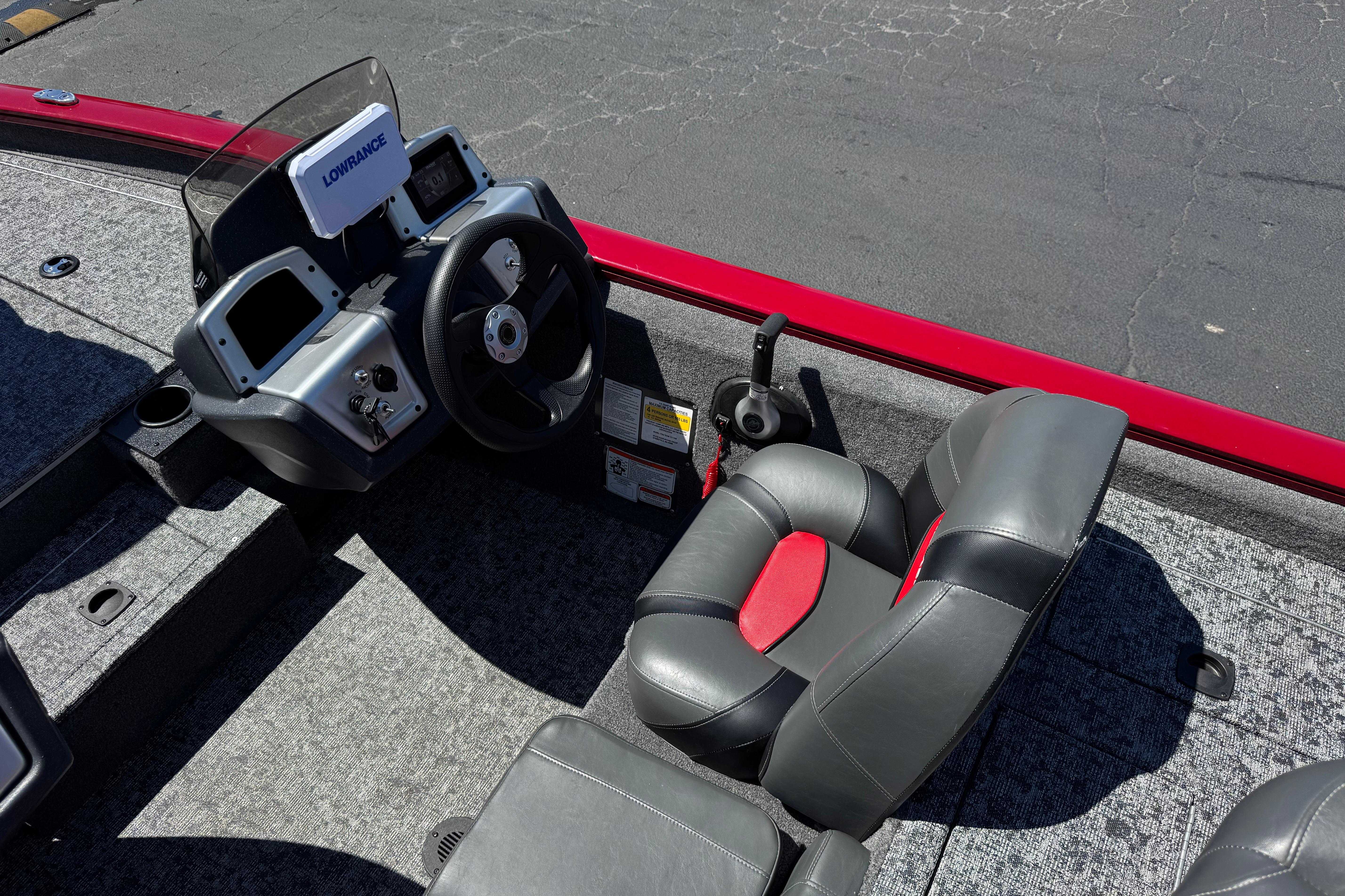 2025 Tracker Pro Team 175 TXW boat interior with steering wheel and seating.