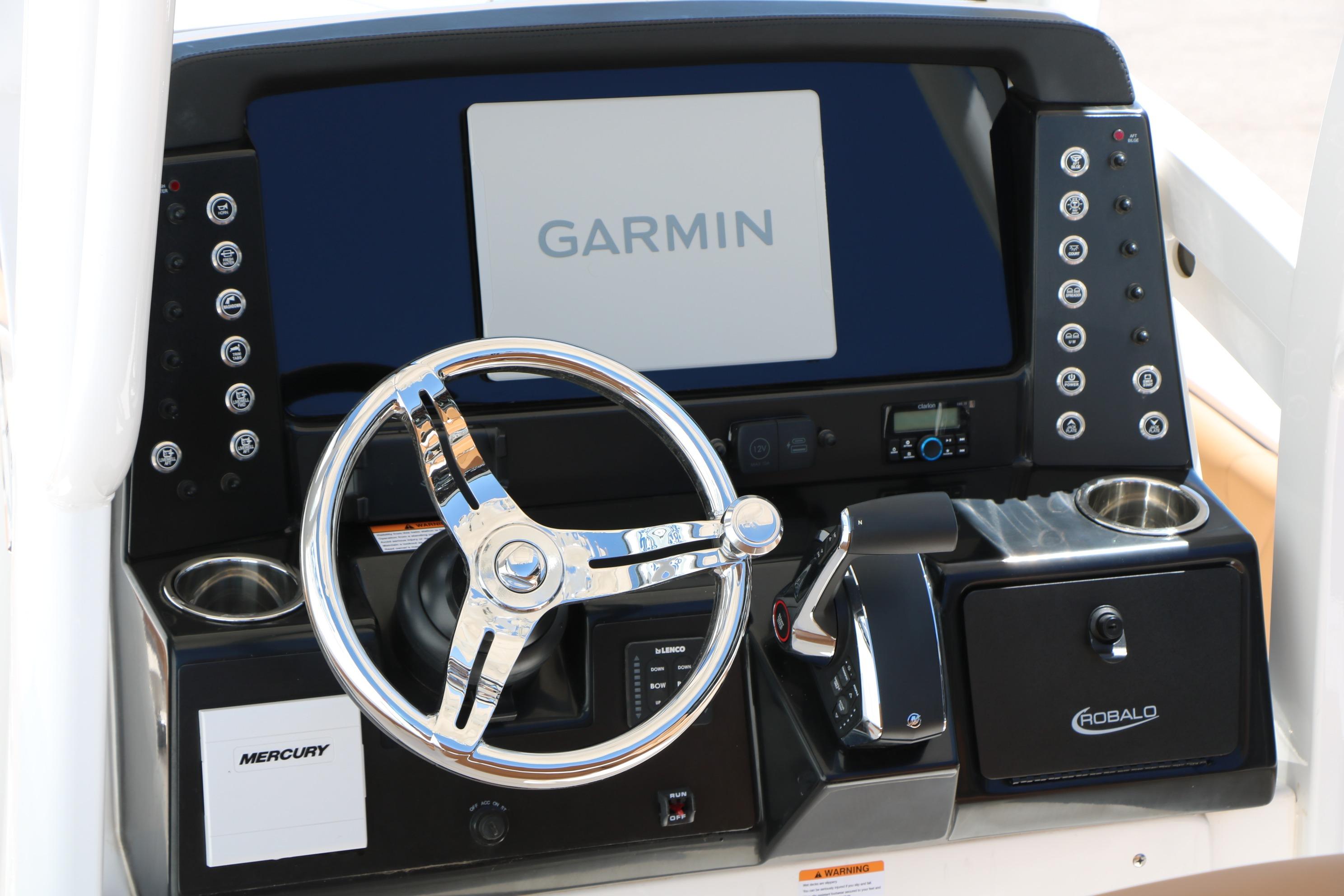 2026 Robalo 246 Cayman boat dashboard with Garmin display and Mercury controls.