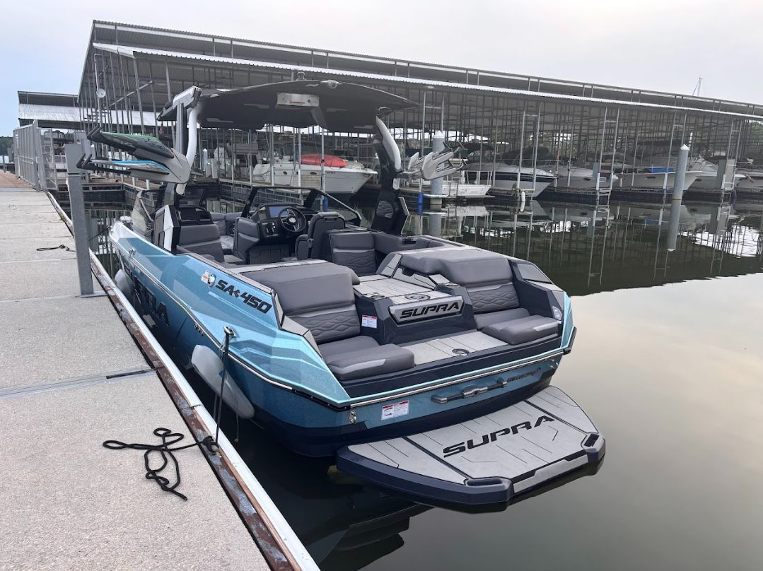2025 Supra SA 450 boat docked, featuring modern design.