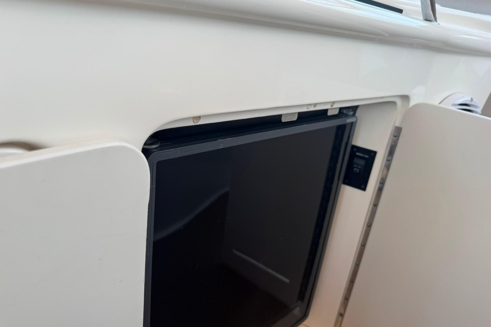 Cabinet door on a 2001 Sea Ray 340 Sundancer boat interior.