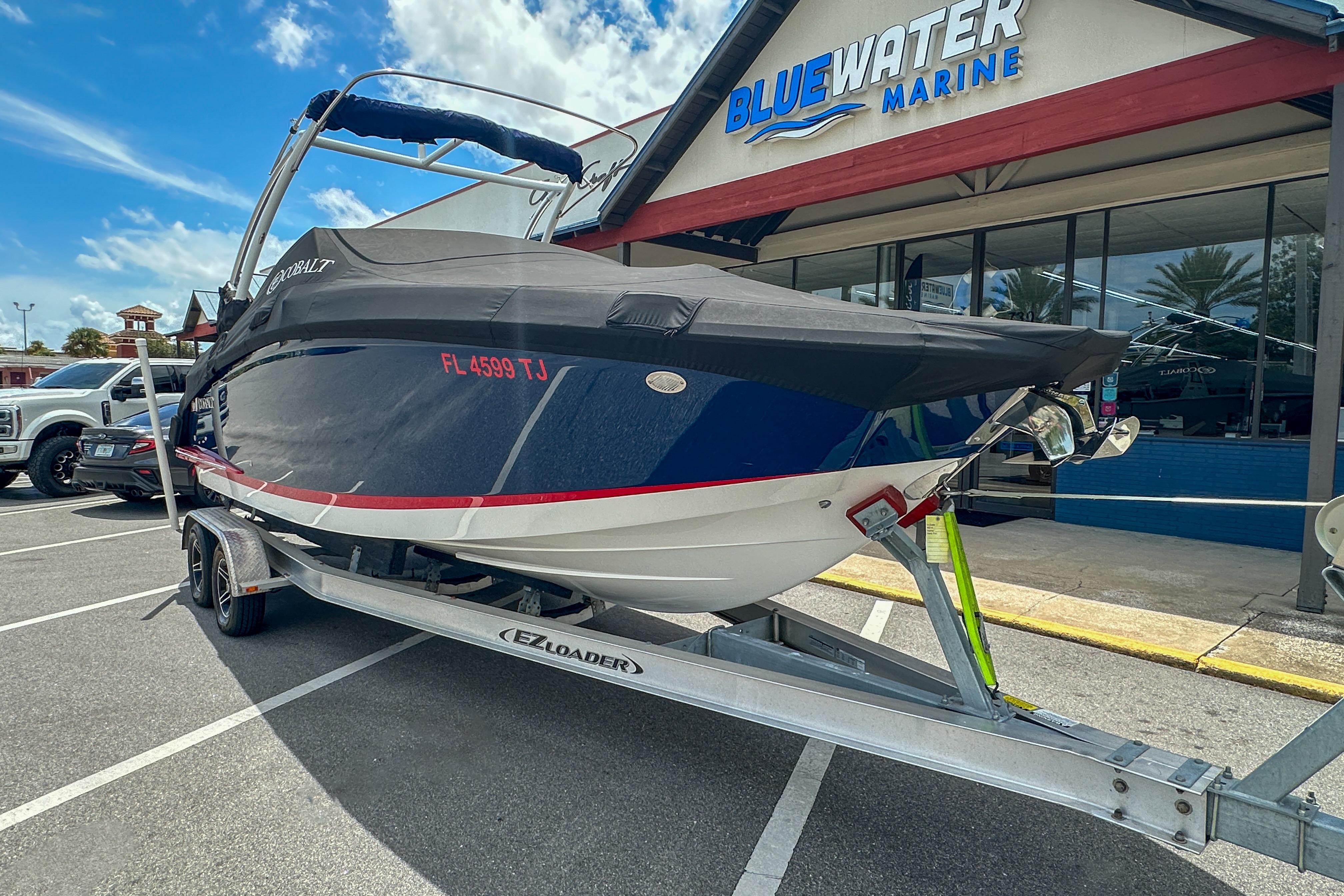 2022 Cobalt 25SC boat on trailer at Bluewater Marine dealership.