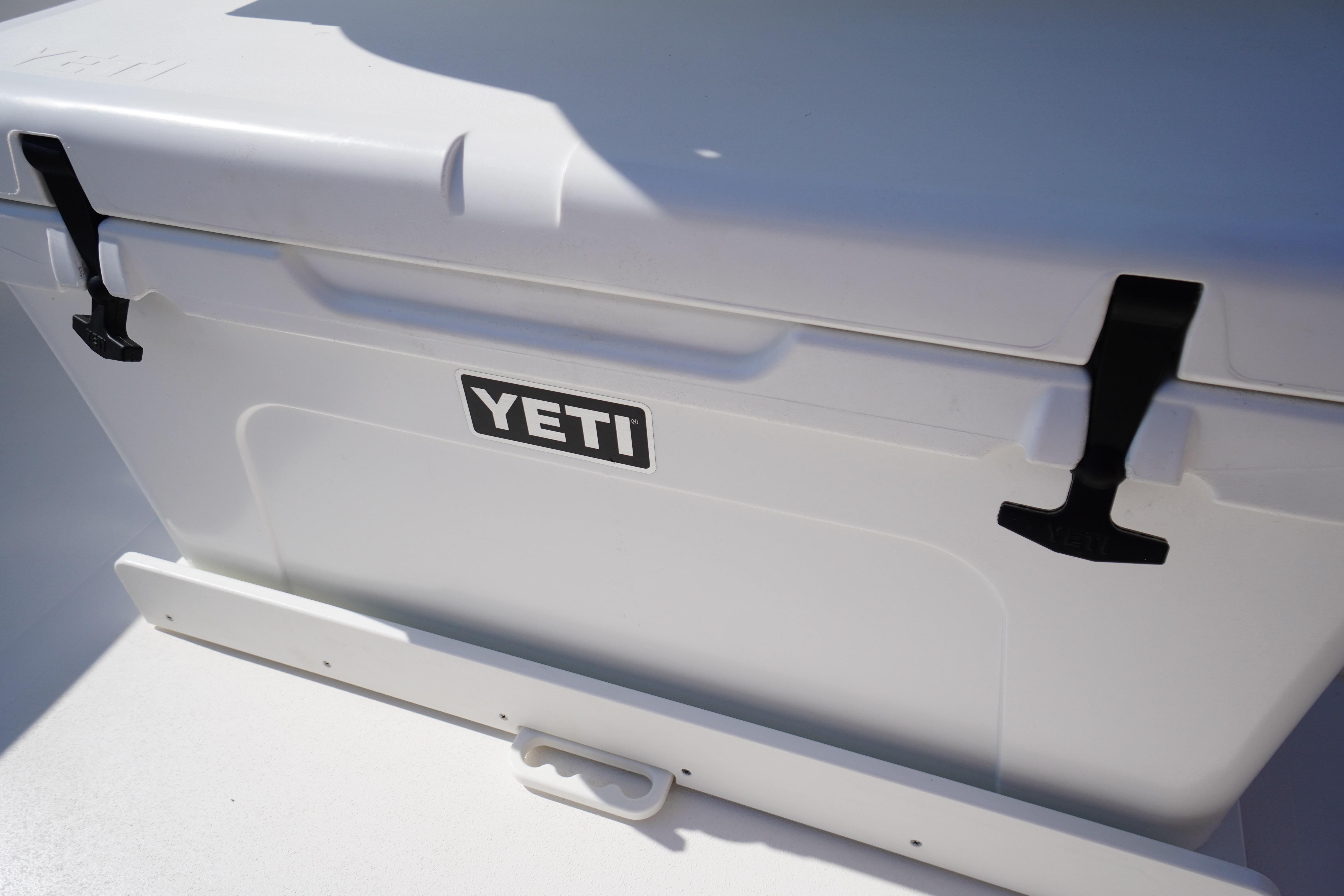YETI cooler on 2025 Tidewater 232 SS boat deck, featuring secure latches.