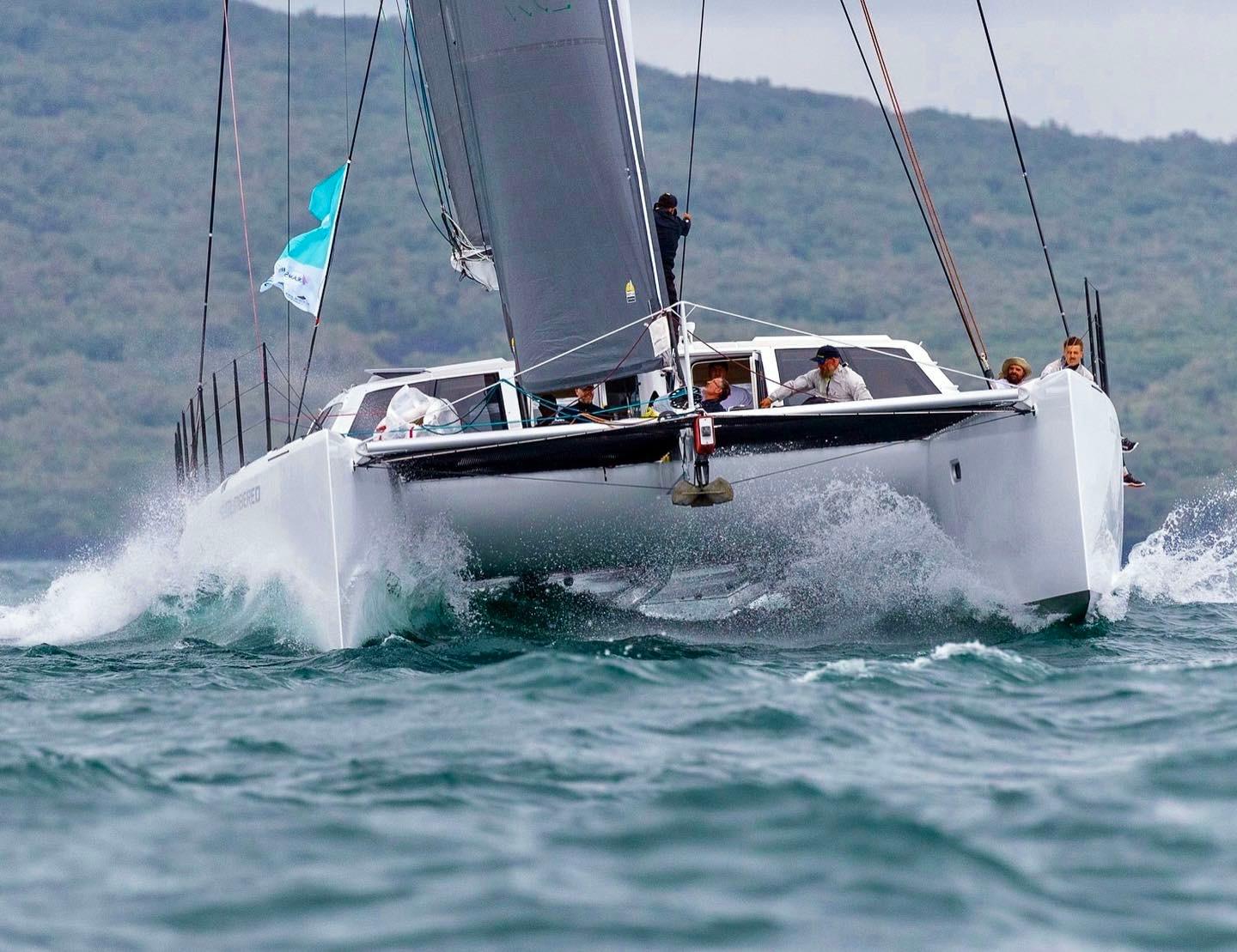 Gunboat 66 sailing on choppy waters, showcasing sleek design and performance.